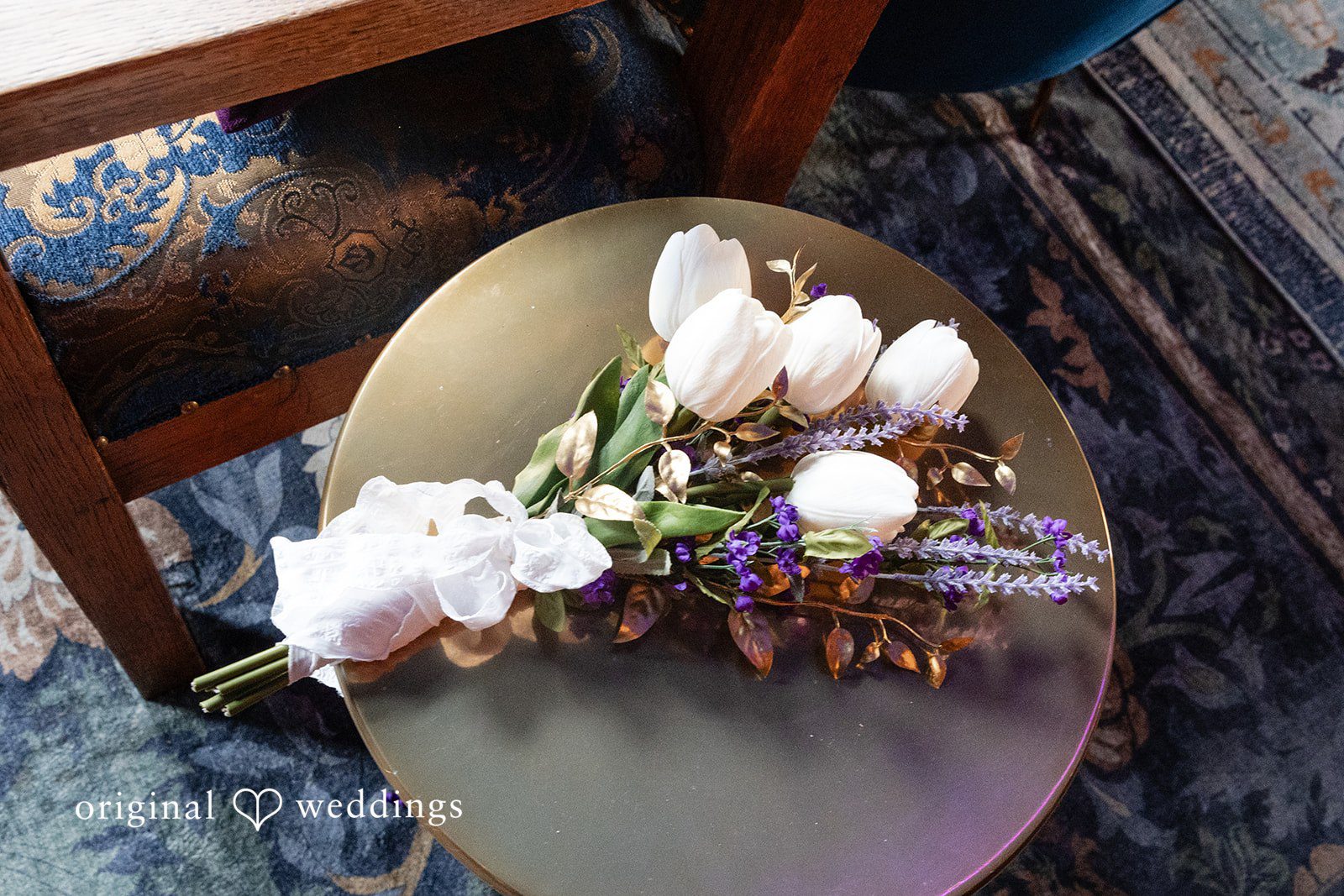 Reception table with florals and gold chargers