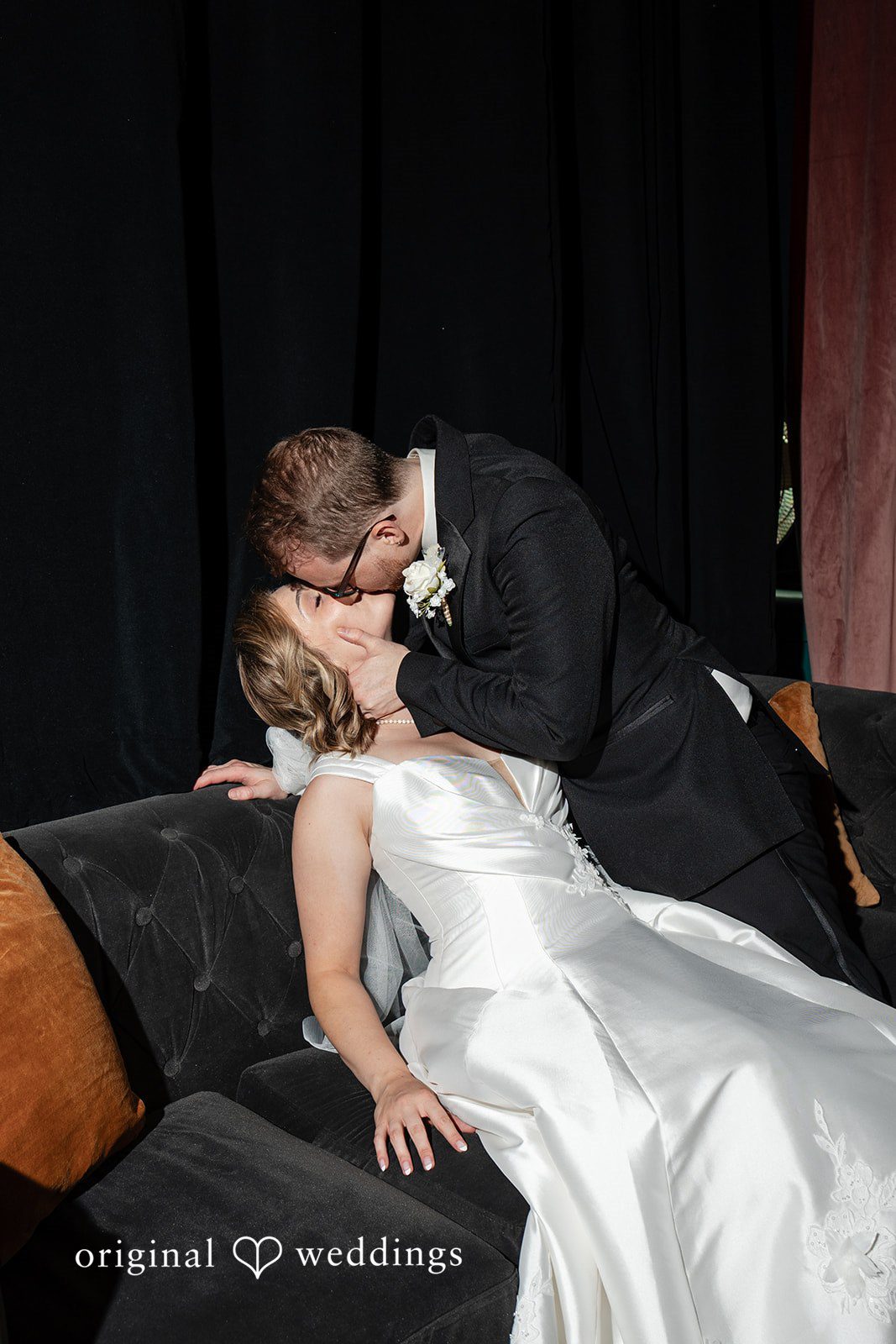 Romantic kiss in dramatic lighting