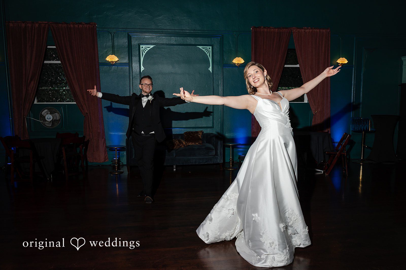Bride dancing with her arm outstretched at Reverie Ballroom