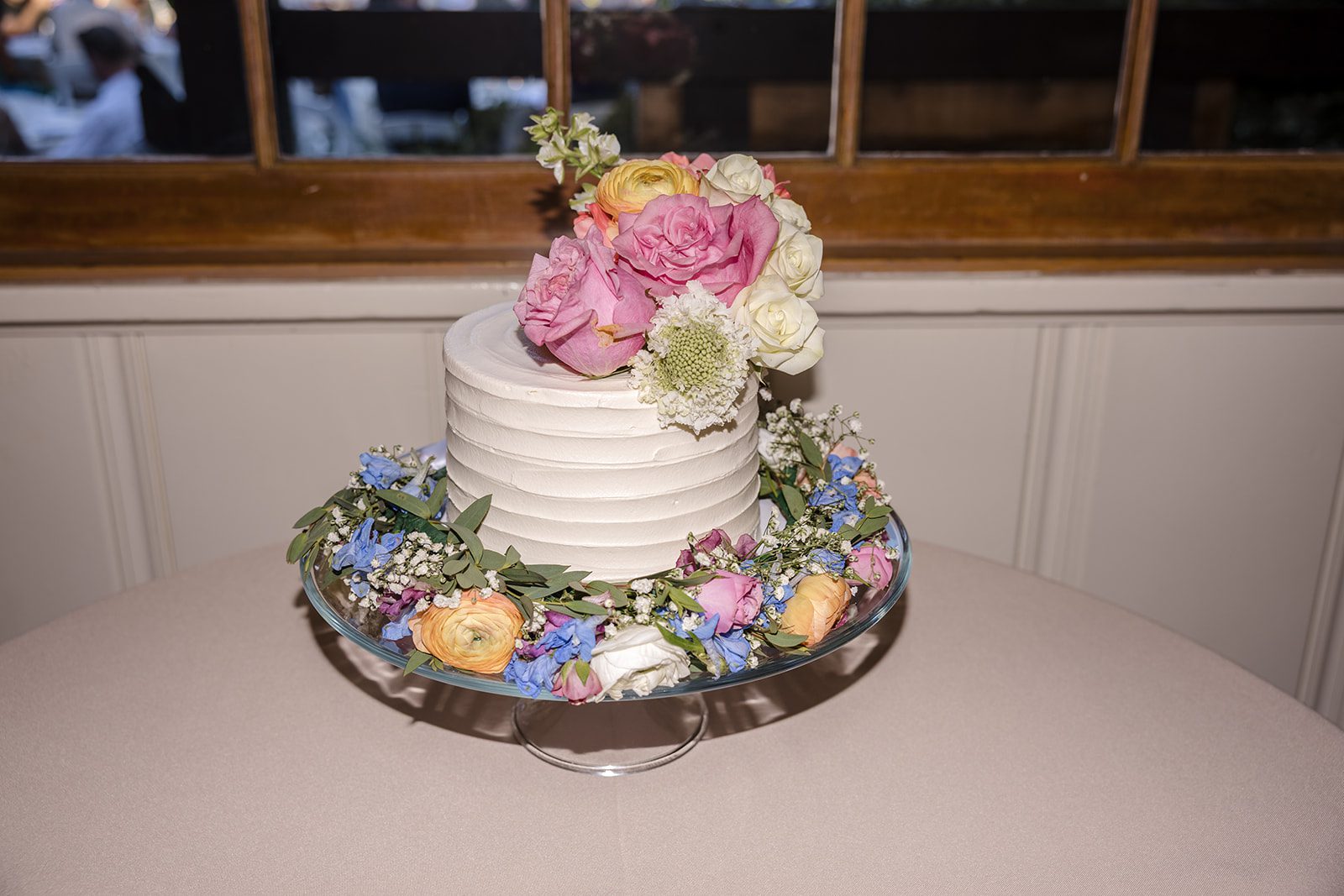 Floral wedding cake on display at Robinswood House