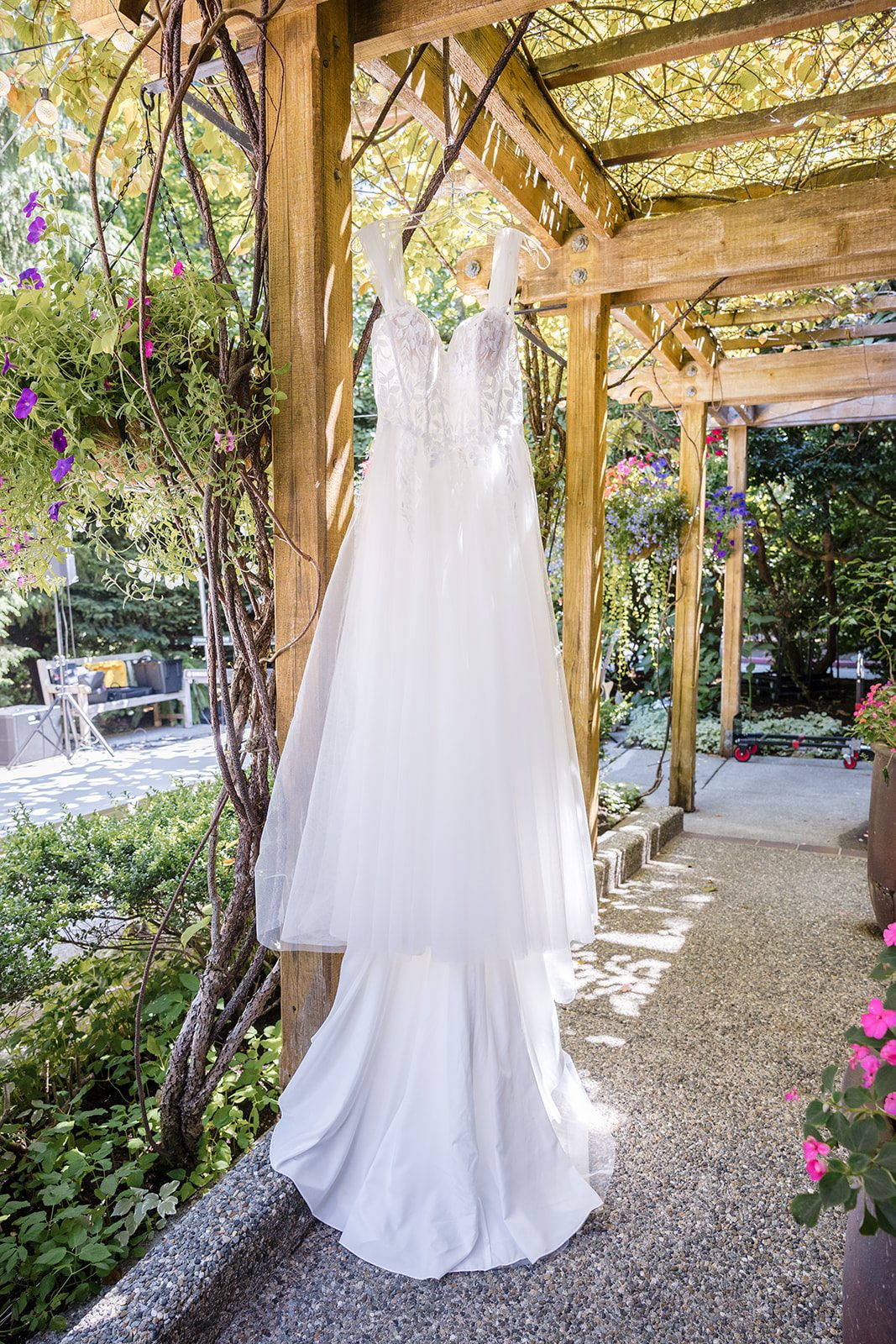 Wedding dress hanging in the garden at Robinswood House