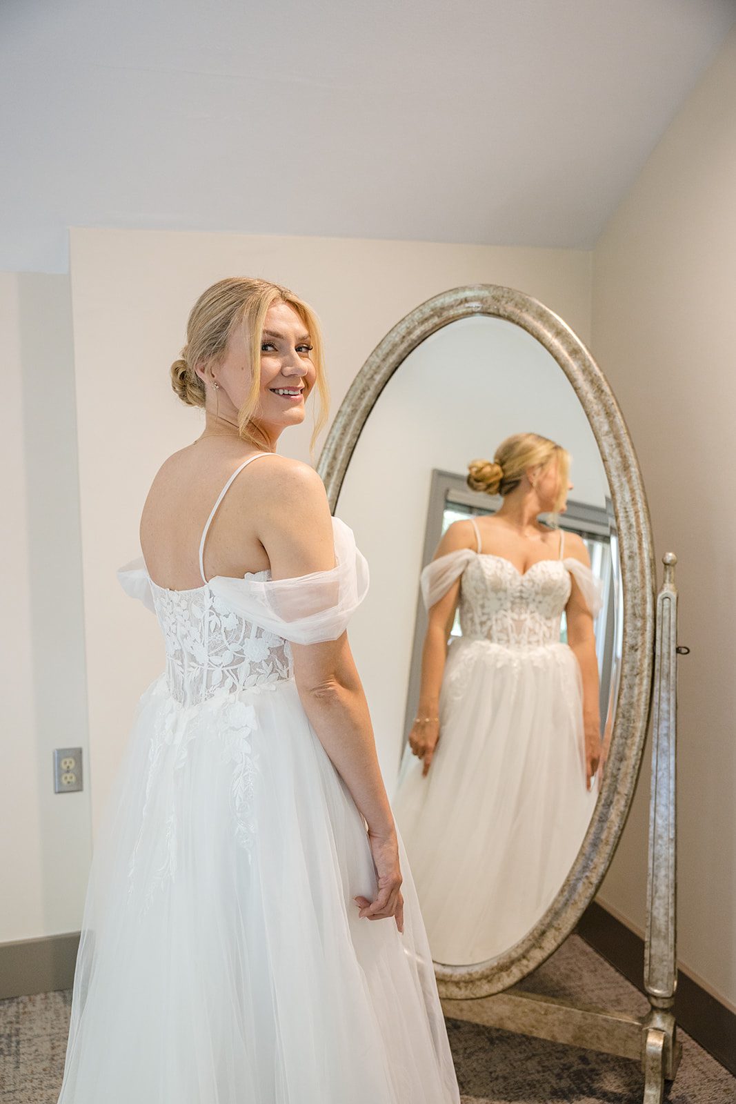 Bride getting ready in front of the mirror