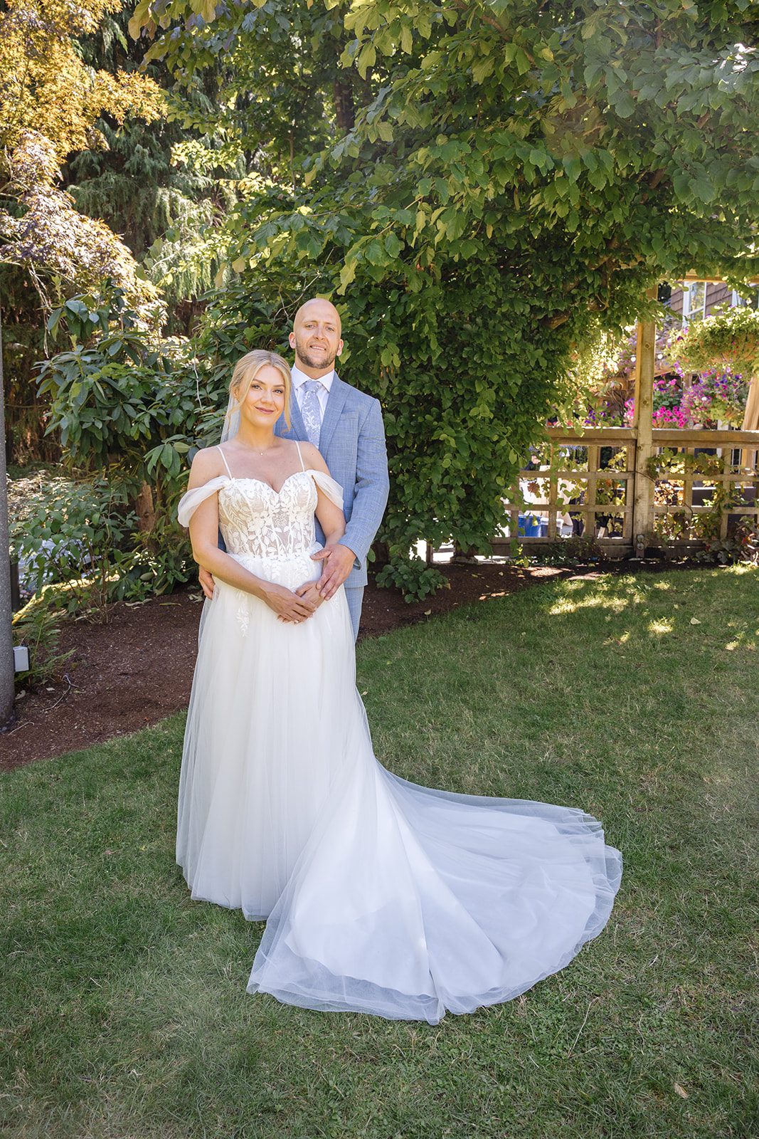 Bride in her gown on the garden lawn at Robinswood House
