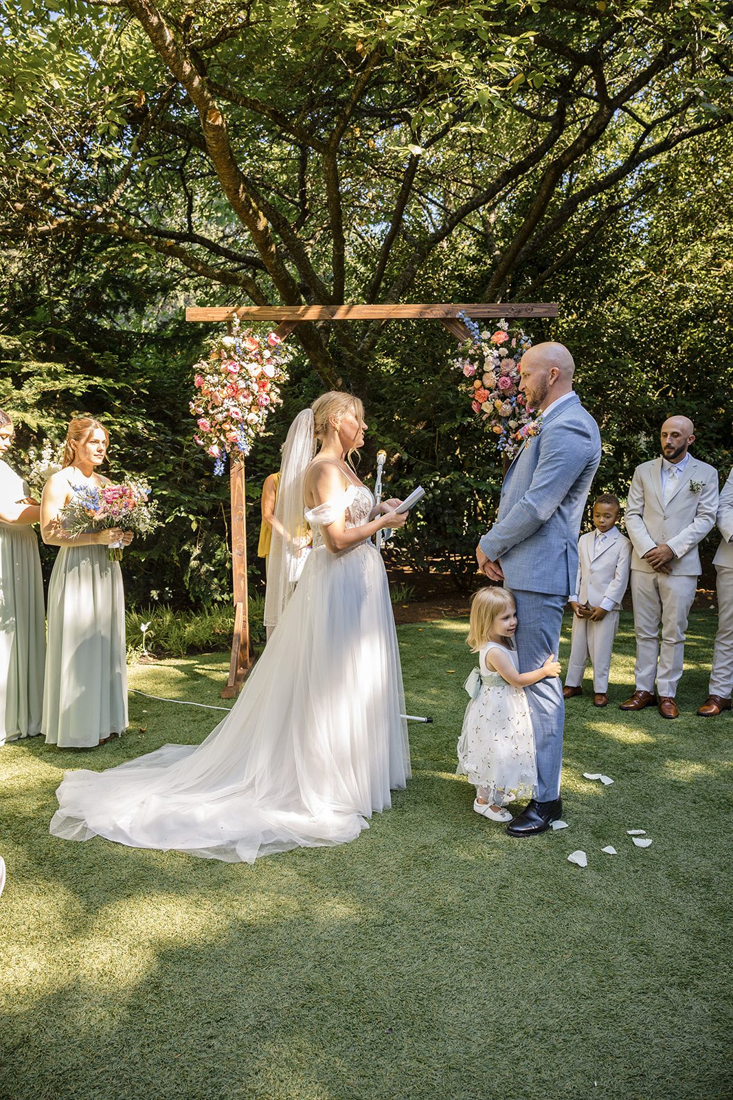 Couple exchanging vows in the garden at Robinswood House