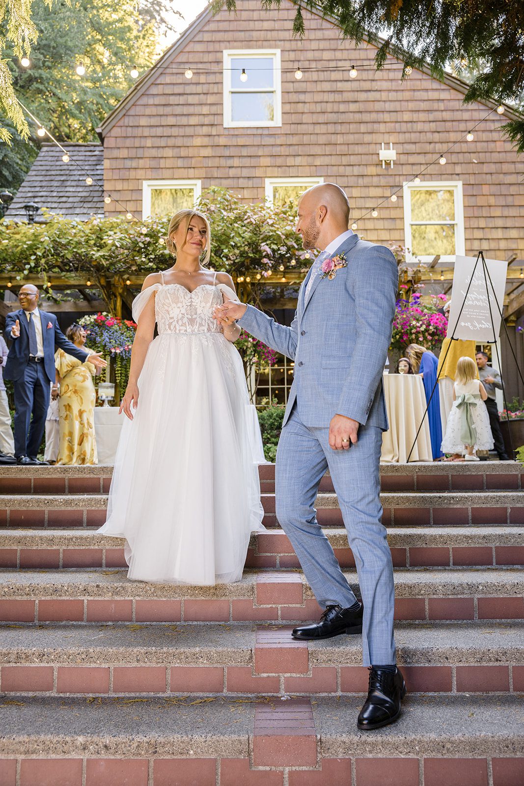 Couple smiling on the steps of Robinswood House