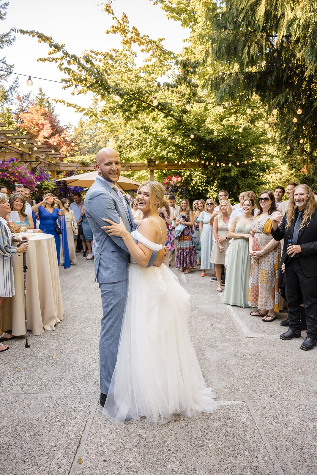 Couple sharing their first dance on the patio