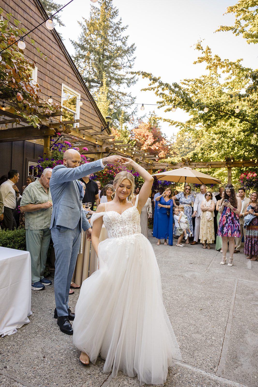 Bride and groom dancing outdoors
