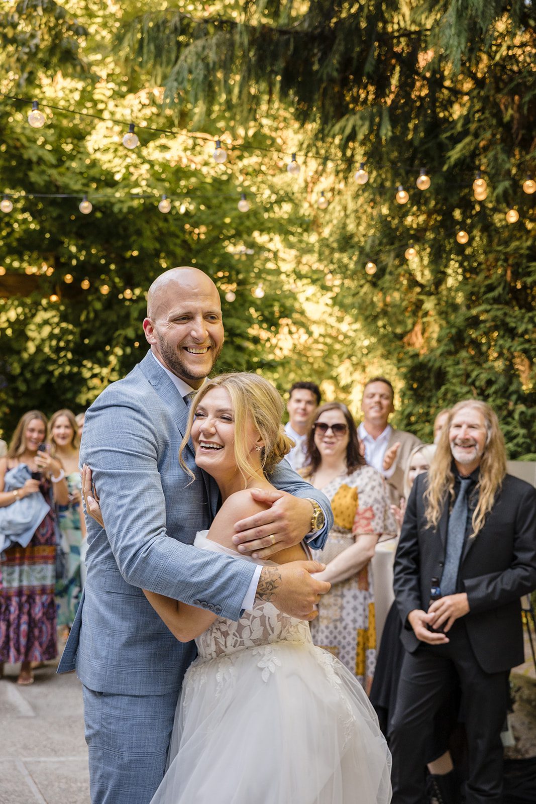 Newlyweds sharing a hug on the dance floor