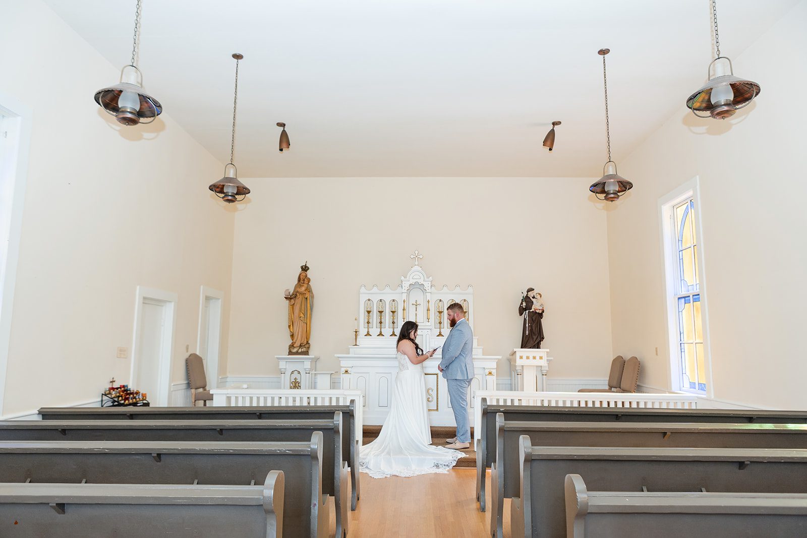 roche-harbor-resort-timeless-seattle-emma-chase-emma-chase-002-42 Bride and groom at the altar of the white chapel at Roche Harbor Resort