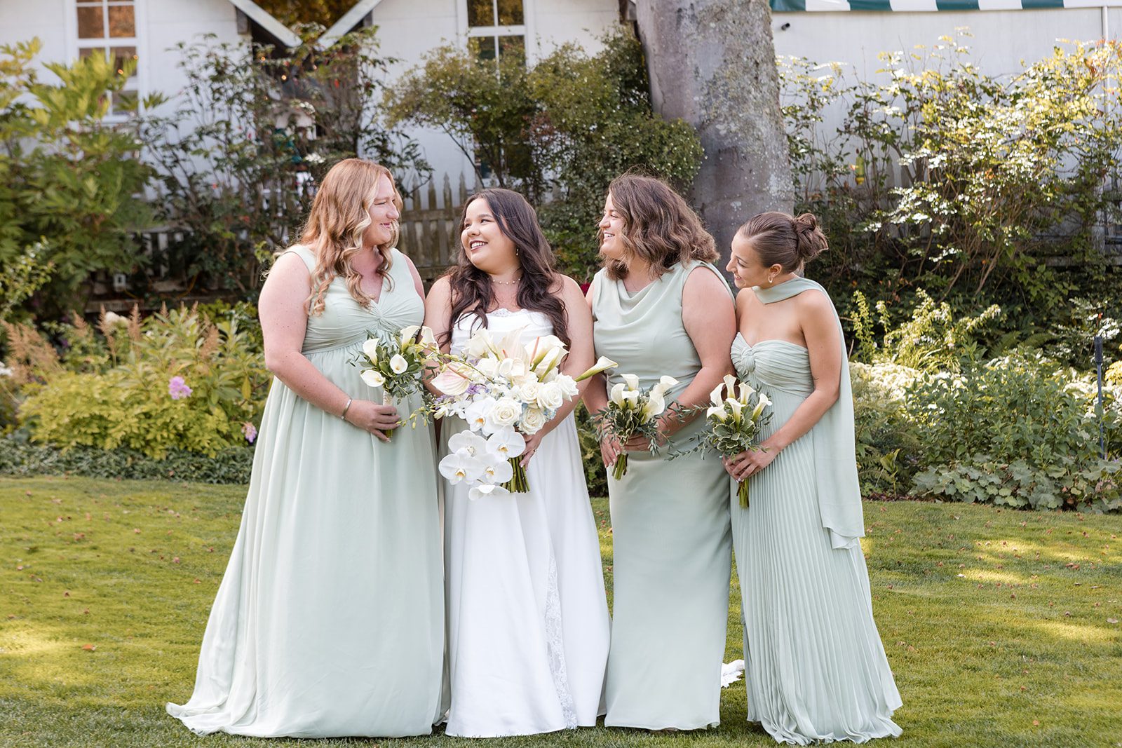 roche-harbor-resort-timeless-seattle-emma-chase-emma-chase-011-20 Bridesmaids in sage green dresses