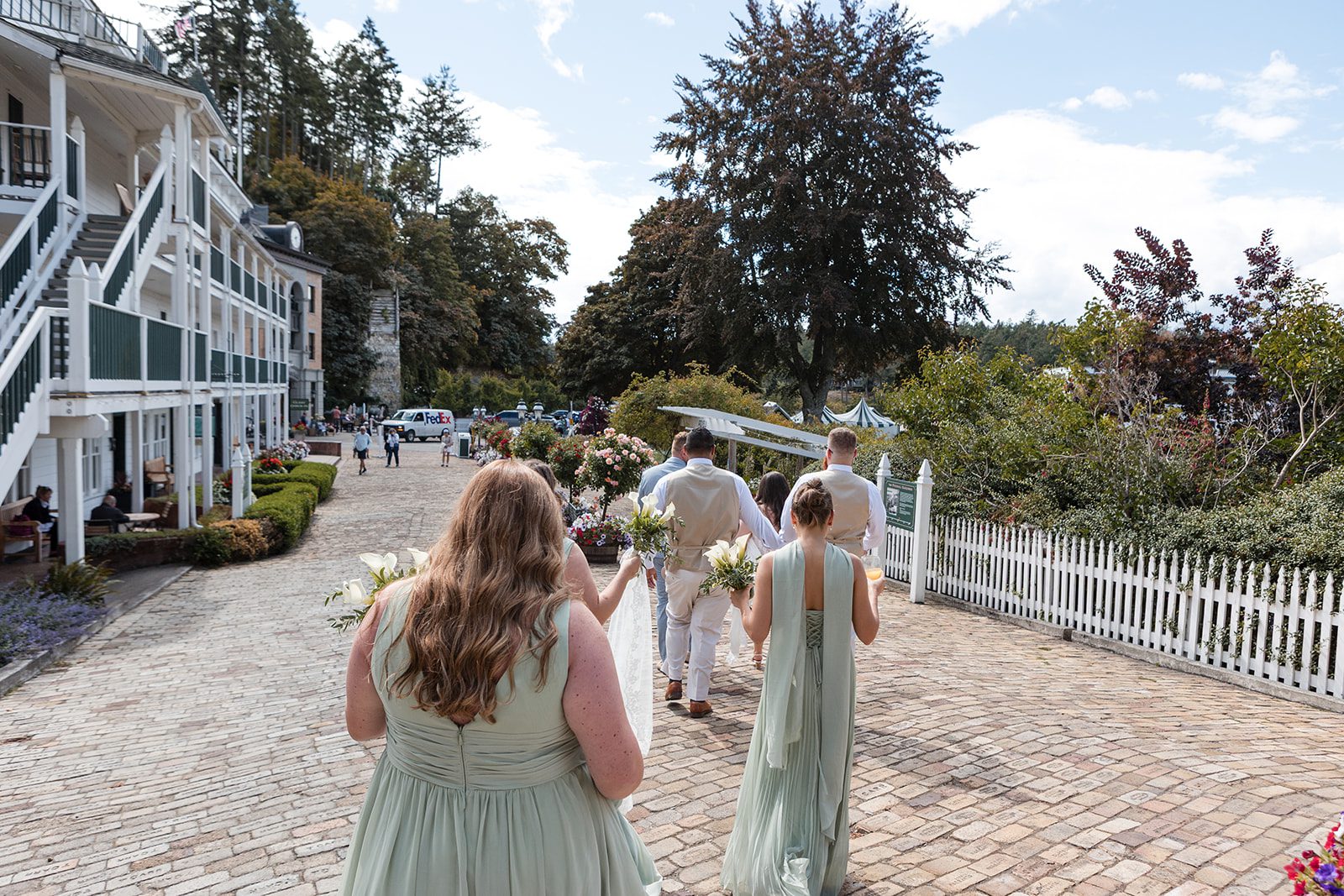 roche-harbor-resort-timeless-seattle-emma-chase-emma-chase-012-26 Bride walking with her bridesmaids through Roche Harbor Resort