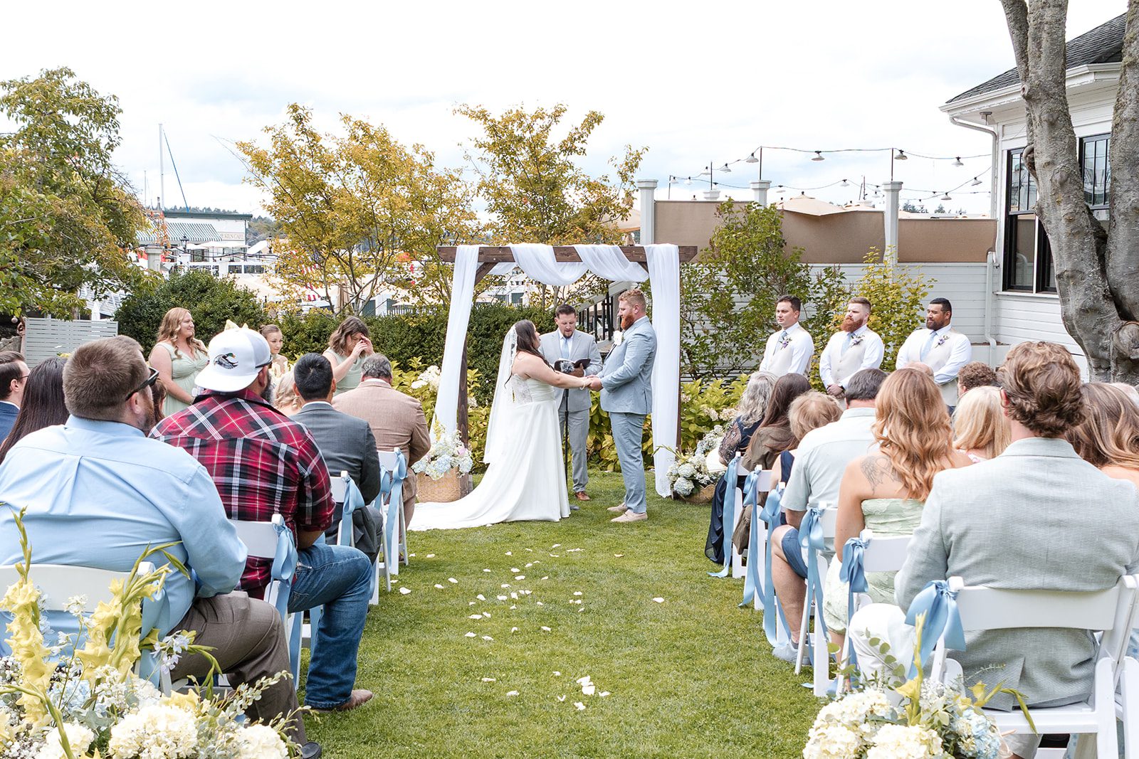roche-harbor-resort-timeless-seattle-emma-chase-emma-chase-018-19 Guests seated for the garden ceremony at Roche Harbor Resort