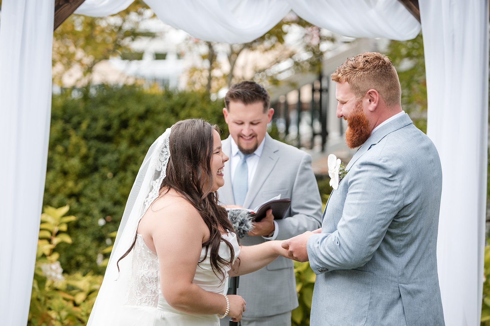 roche-harbor-resort-timeless-seattle-emma-chase-emma-chase-020-23 Emma and Chase exchanging vows with their officiant