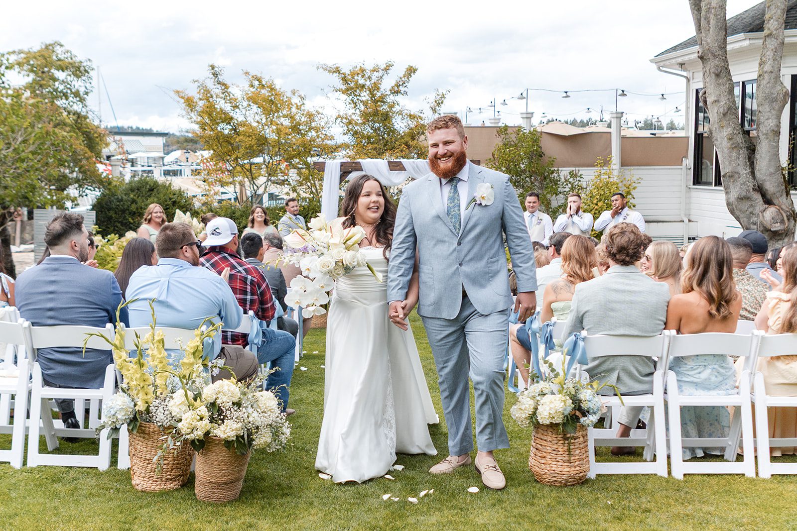 roche-harbor-resort-timeless-seattle-emma-chase-emma-chase-023-17 Couple celebrating with guests after their vows