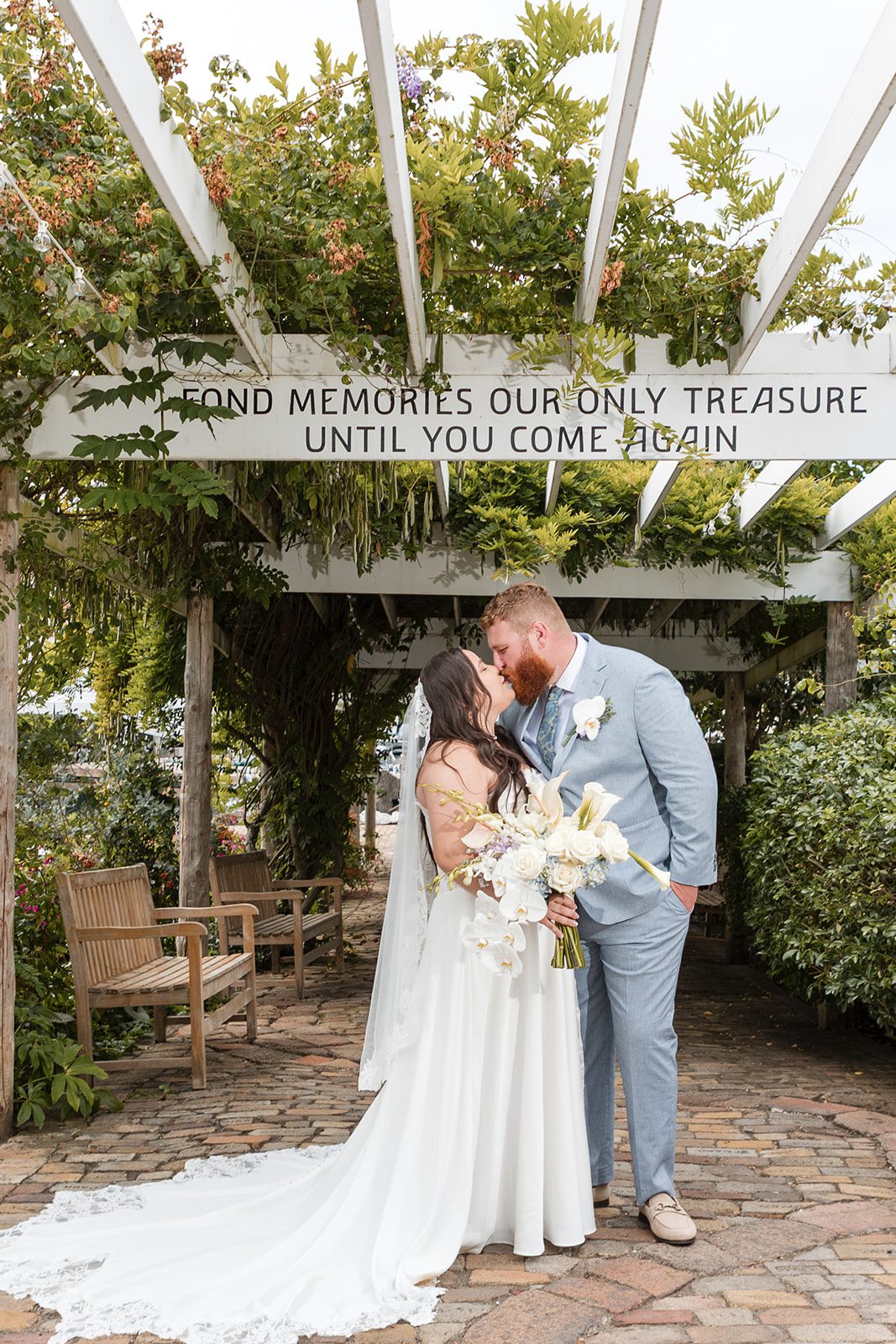 roche-harbor-resort-timeless-seattle-emma-chase-emma-chase-025-10 Bride and groom under the garden pergola at Roche Harbor Resort