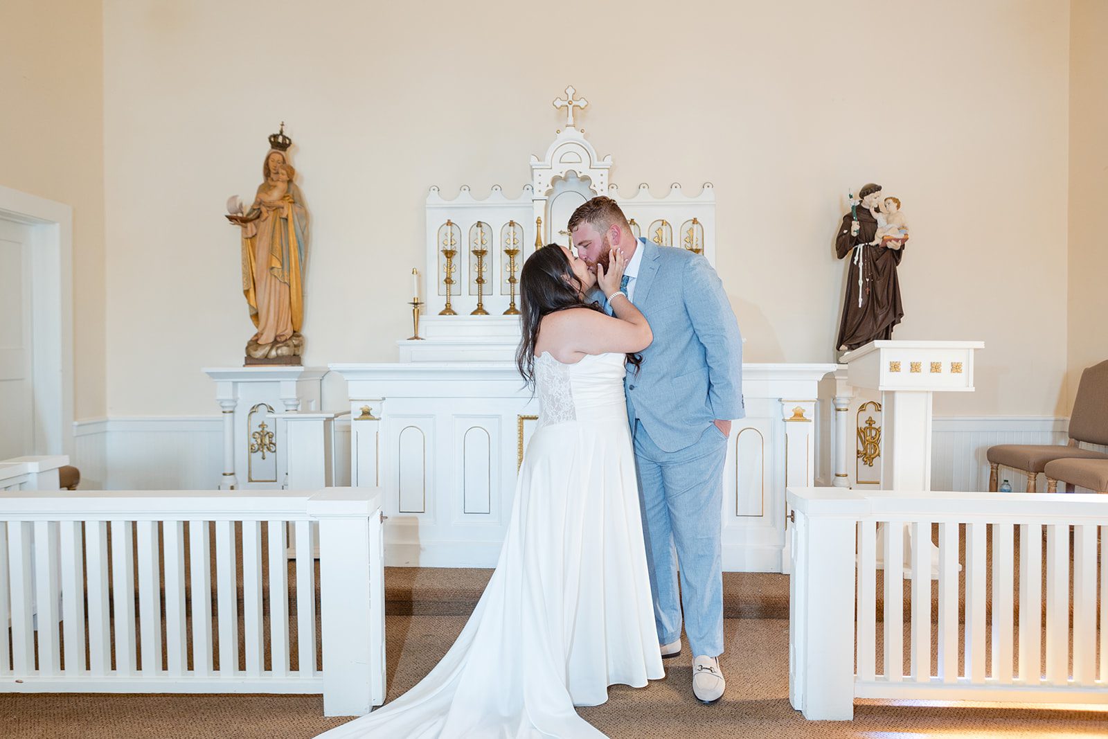 roche-harbor-resort-timeless-seattle-emma-chase-emma-chase-027-22 Couple sharing a kiss inside the chapel