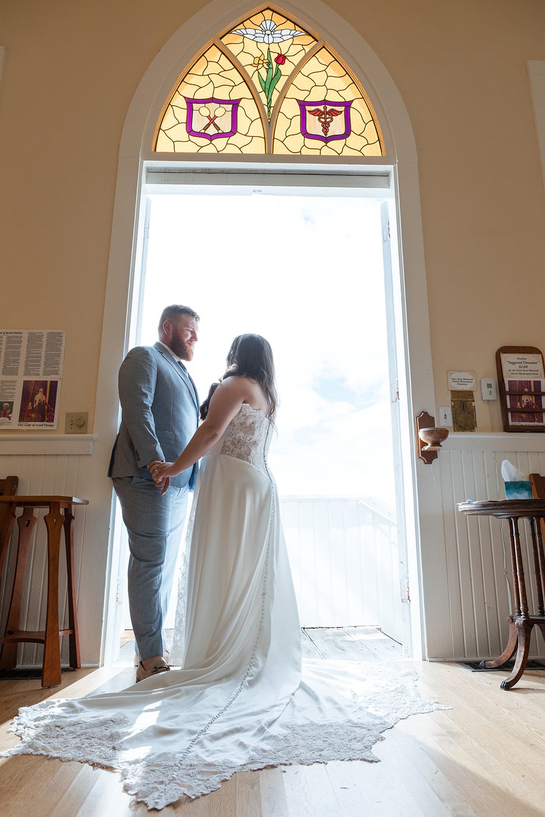 roche-harbor-resort-timeless-seattle-emma-chase-emma-chase-028-34 Bride and groom at the chapel doorway