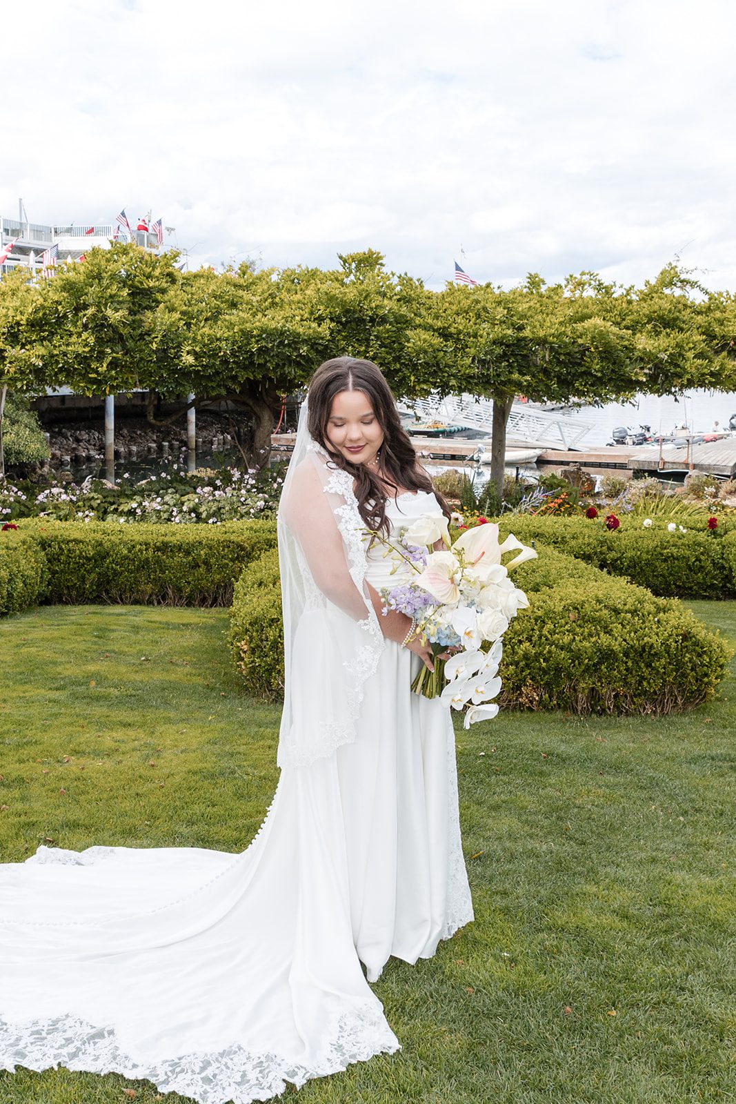 roche-harbor-resort-timeless-seattle-emma-chase-emma-chase-030-38 Bride and groom in the garden with her veil flowing