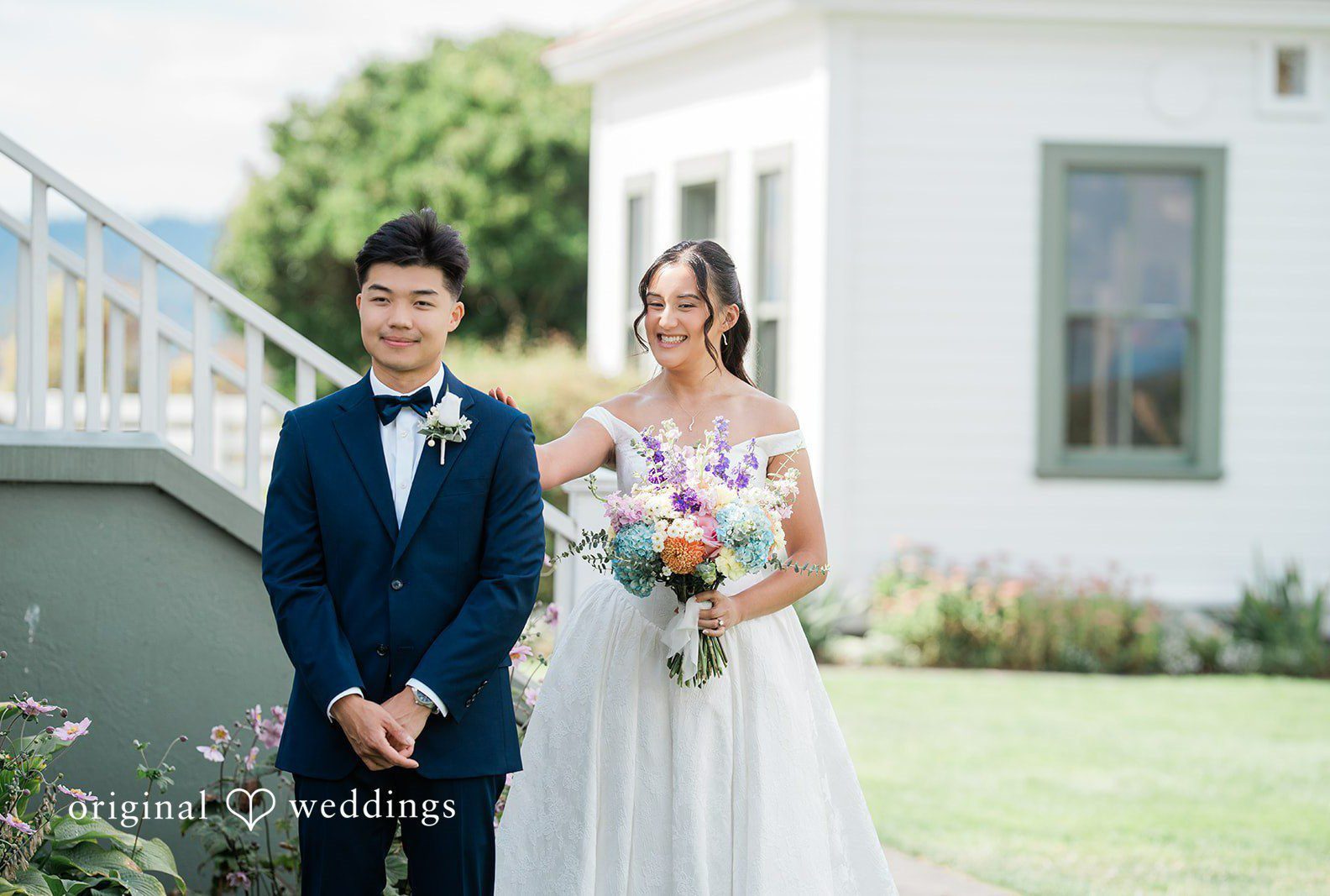 Bianca and Russell posing together on the lawn, captured by Seattle wedding photographers from Original Weddings at RoseHill Community Center