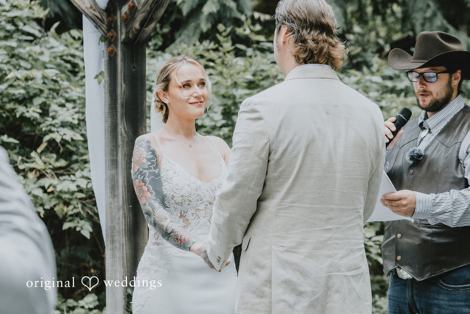 Kailyn + Tony Couple saying their vows with the officiant at Samara Farm