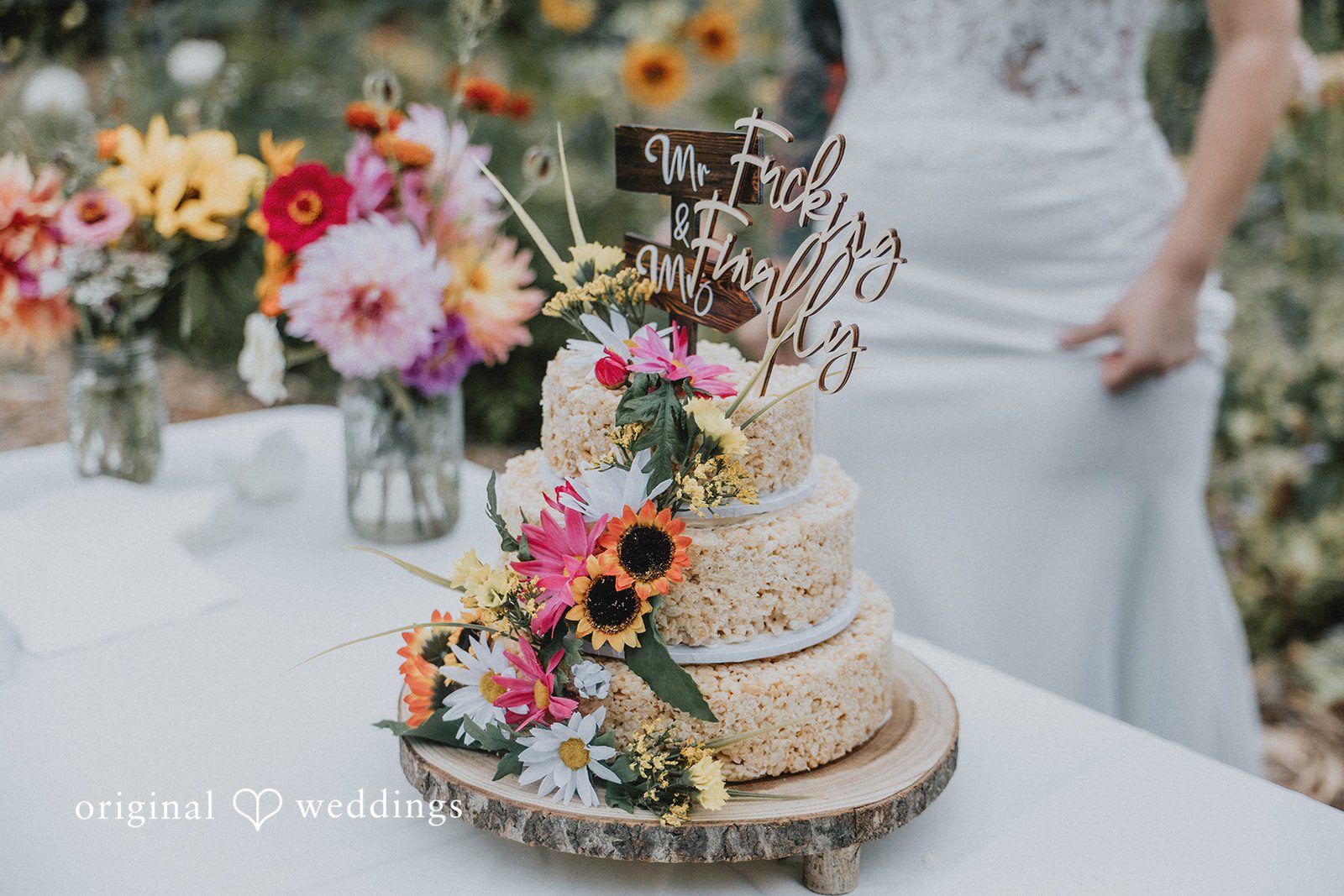 Kailyn + Tony Wedding cake decorated with colorful flowers