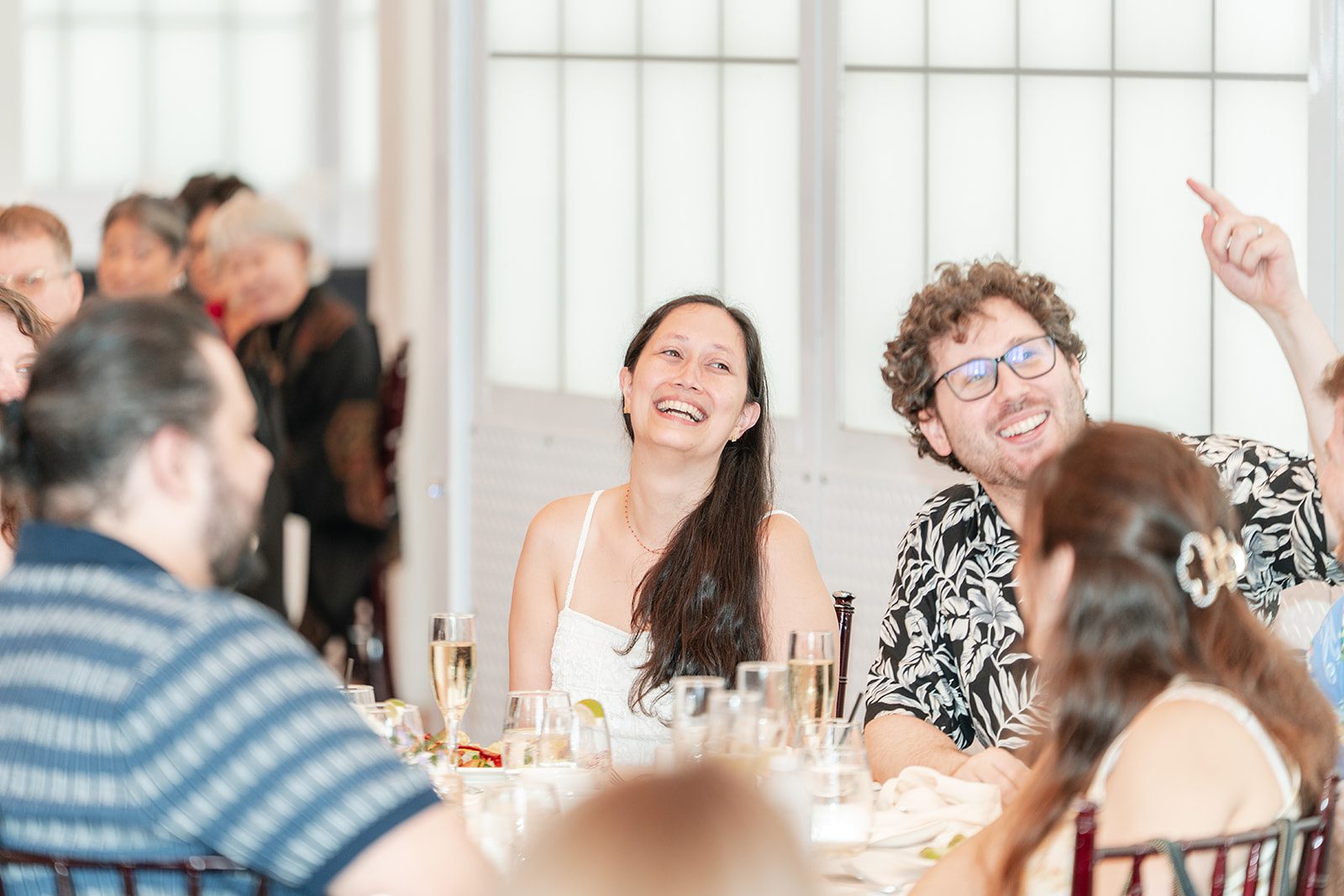 scotts-seafood-grill-bar-timeless-san-francisco-libby-ethan-p012-03 Bride laughing with guests at Scott's Seafood Grill & Bar