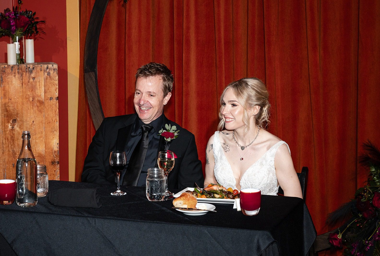 Couple at the sweetheart table, captured by Seattle wedding photographers from Original Weddings at Georgetown Ballroom