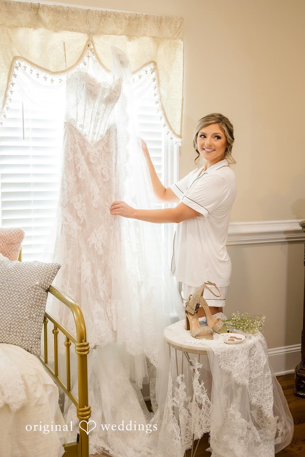 Holly + Adam Bride with her gown by the window