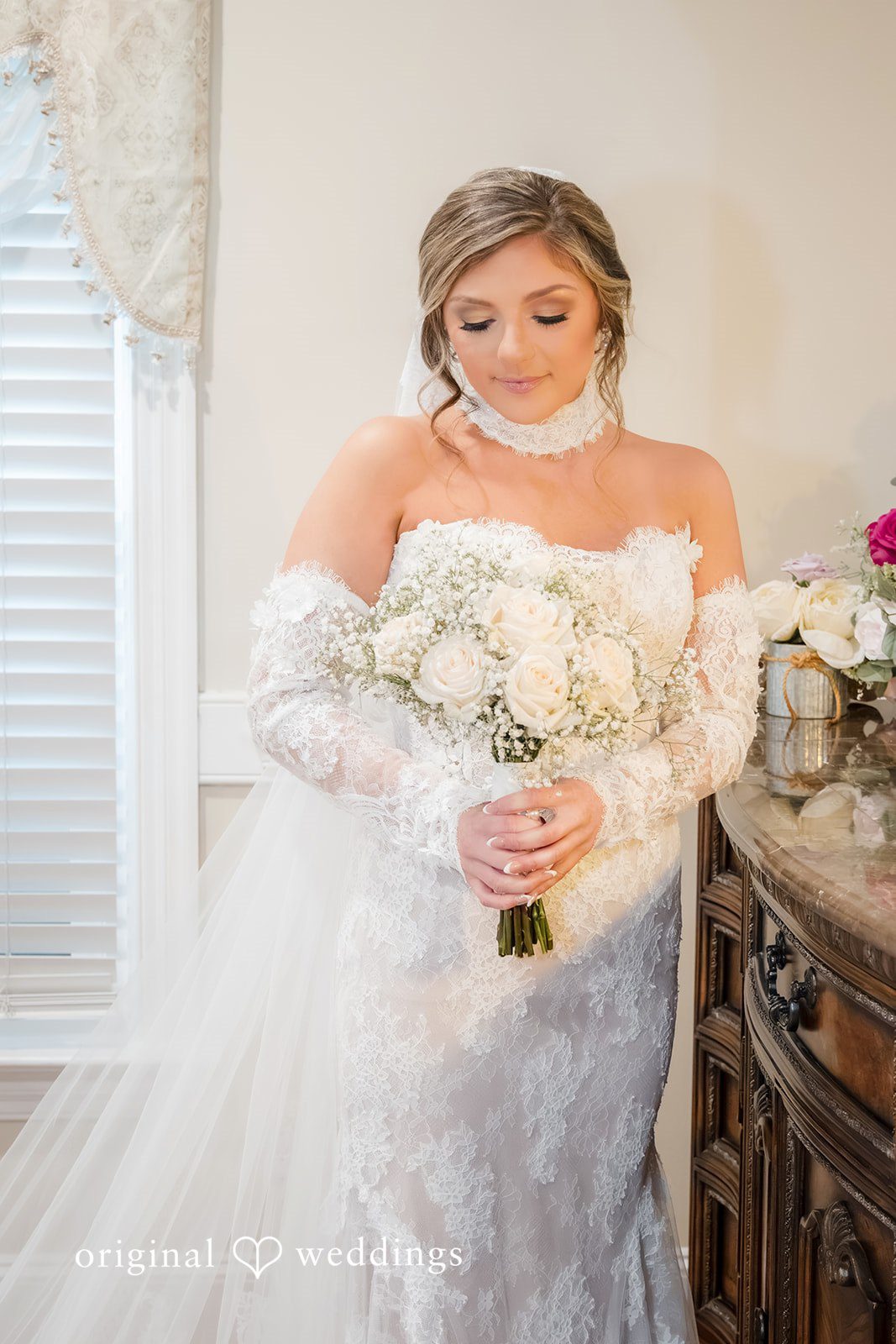 Holly + Adam Bride with her bouquet indoors