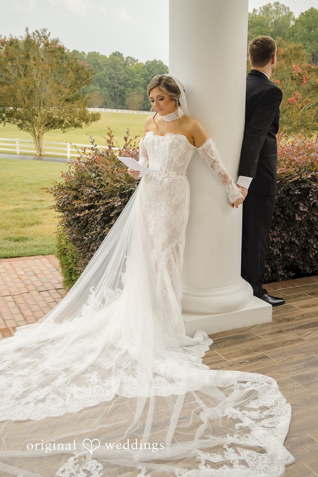 Holly + Adam Bride's train beside a column at Seven Paths Manor