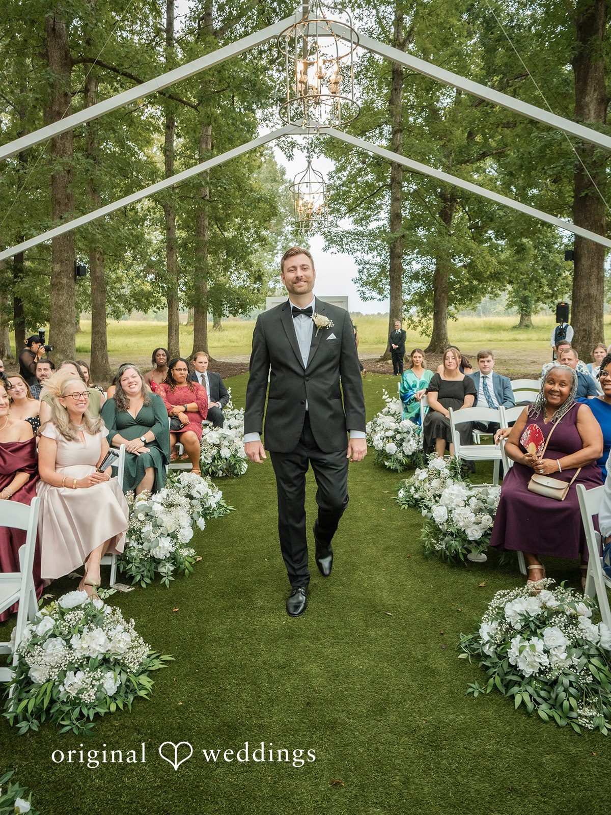 Holly + Adam Groom walking down the aisle at Seven Paths Manor