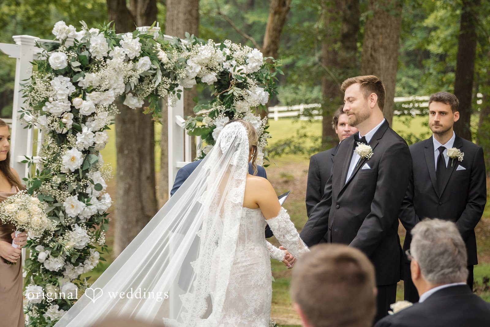 Holly + Adam Couple at the floral arch