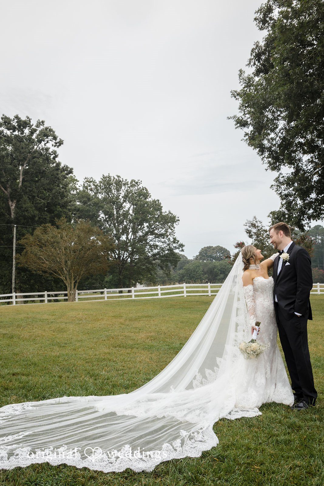 Holly + Adam Couple with the veil flowing