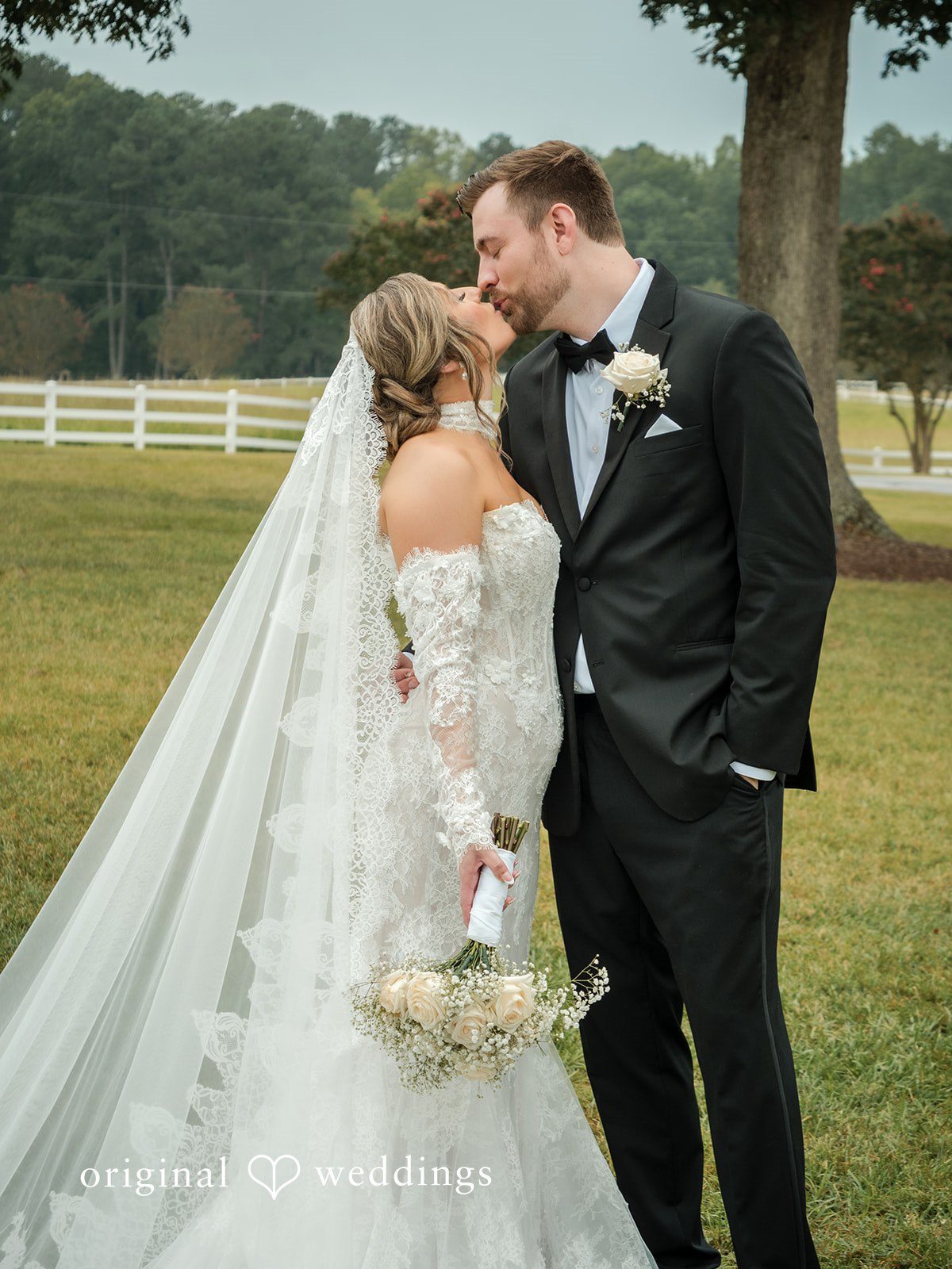 Holly + Adam Couple kissing on the lawn