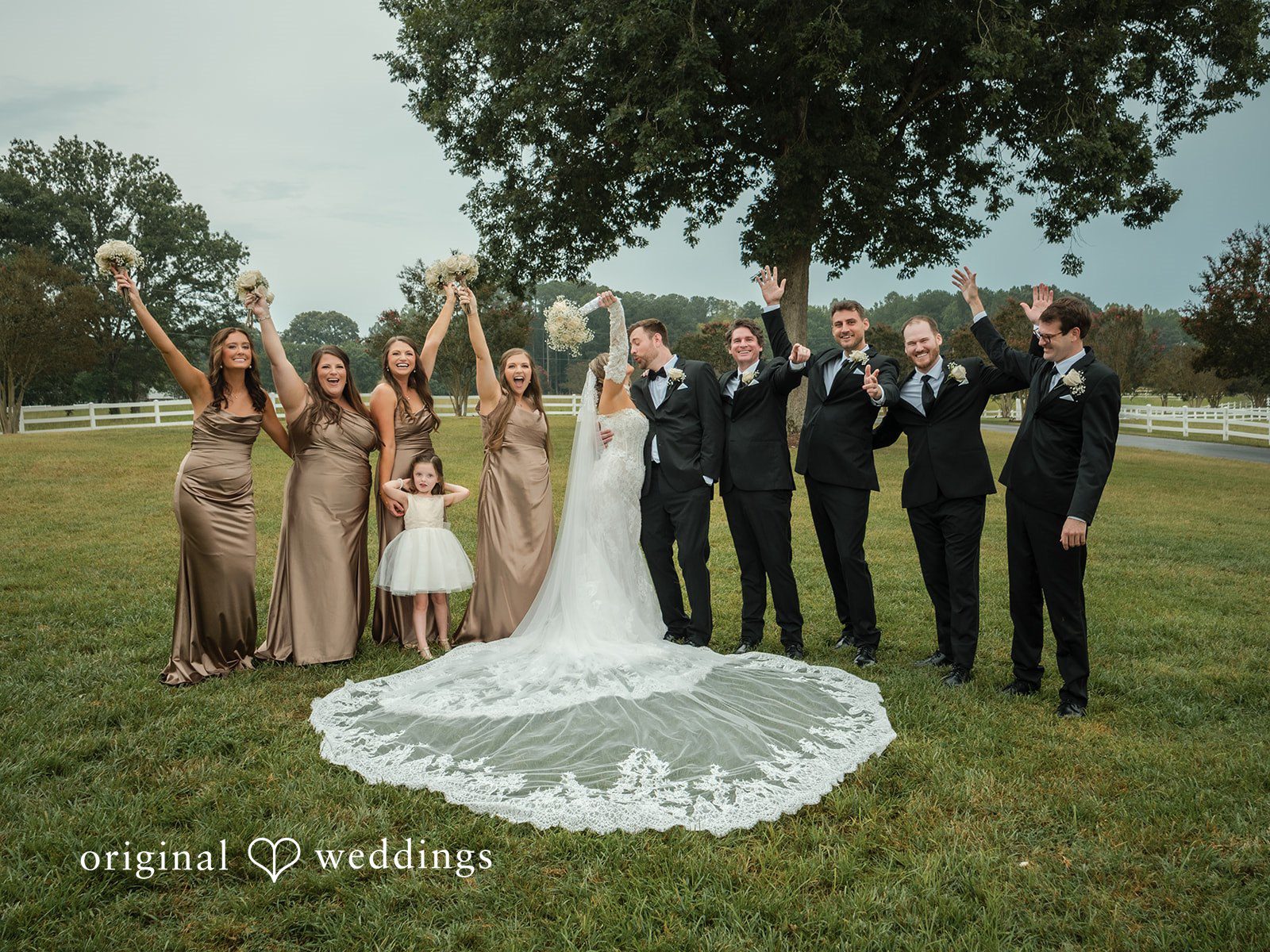 Holly + Adam Couple with the wedding party in the field