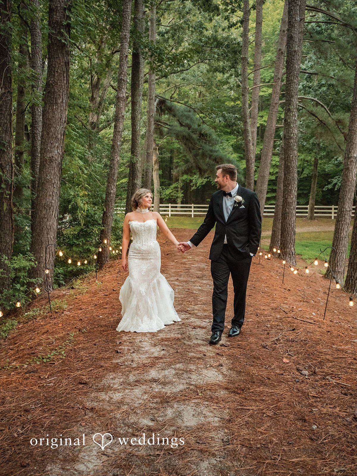 Holly + Adam Couple walking through the woods at Seven Paths Manor