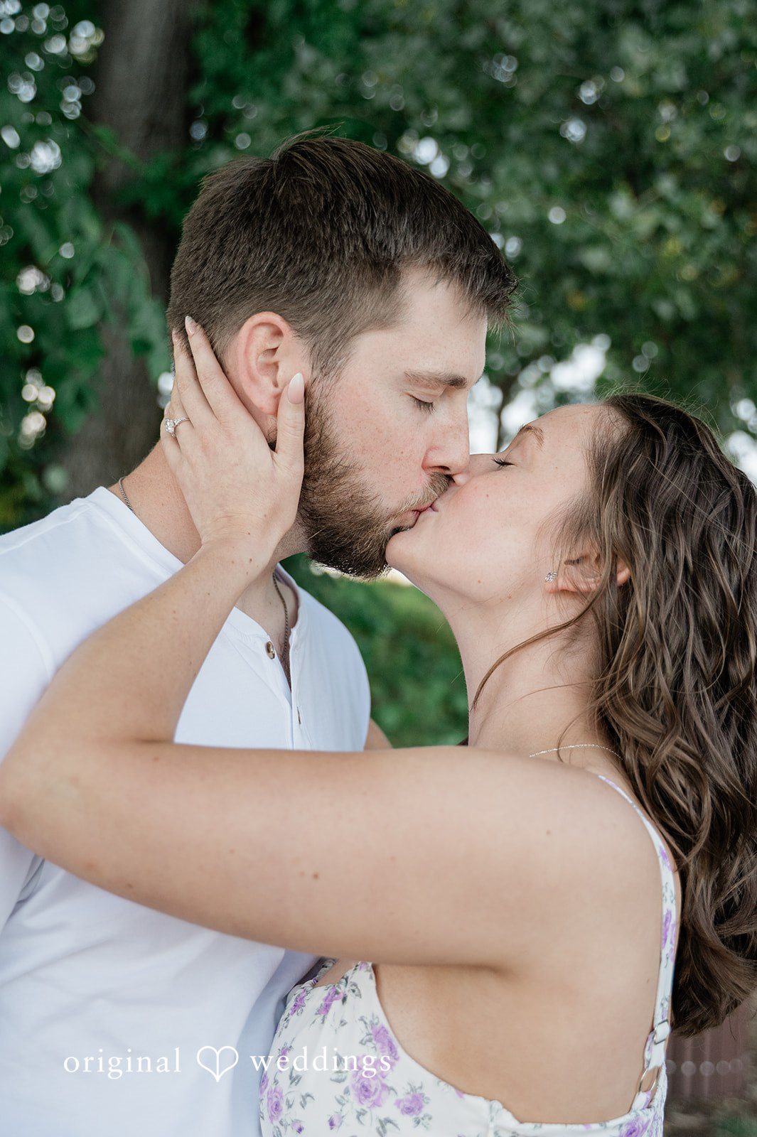 Jada + Nathan Couple kissing among the trees at Silverwood Park