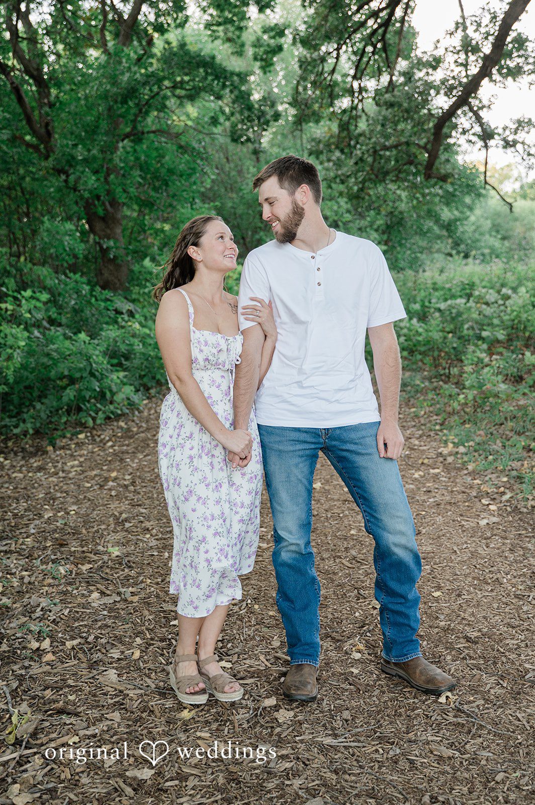 Jada + Nathan Couple standing on a wooded trail during Engagement Photography Services at Silverwood Park