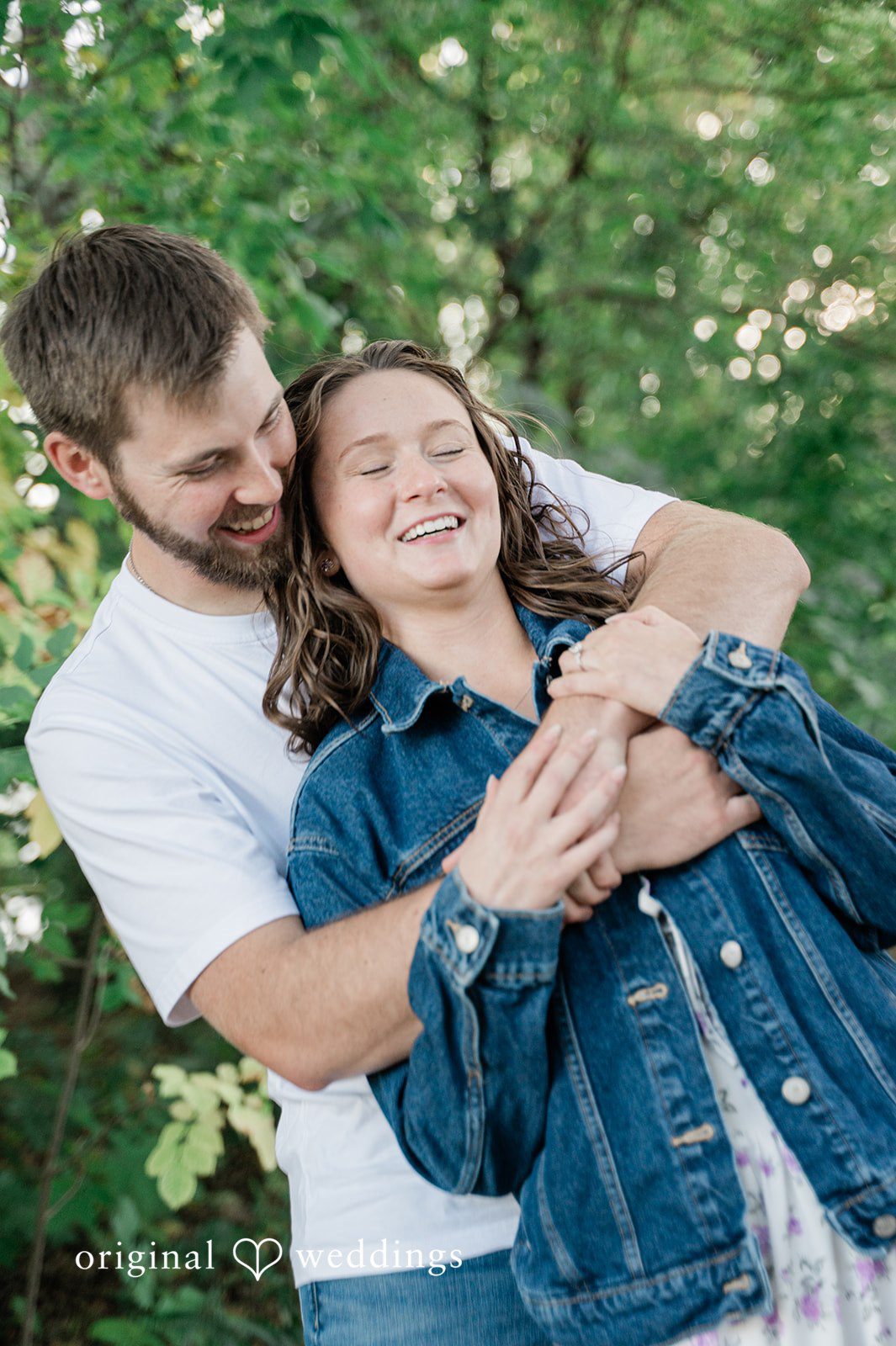 Jada + Nathan Couple laughing in a hug, captured with Engagement Photography Services from Original Weddings at Silverwood Park