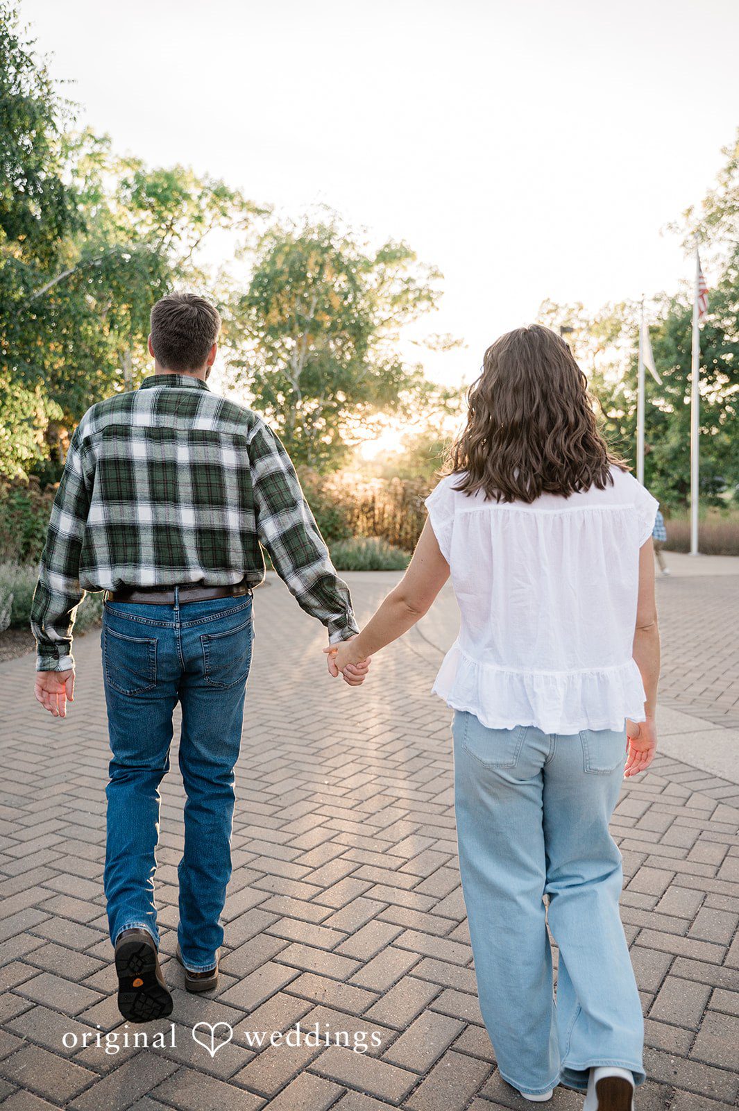 Jada + Nathan Couple walking hand in hand at Silverwood Park