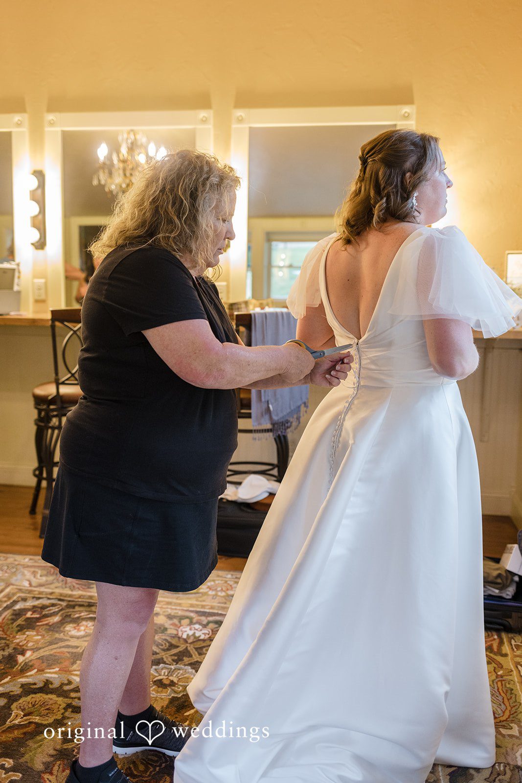 Faith + Brandon Bride getting her dress fastened