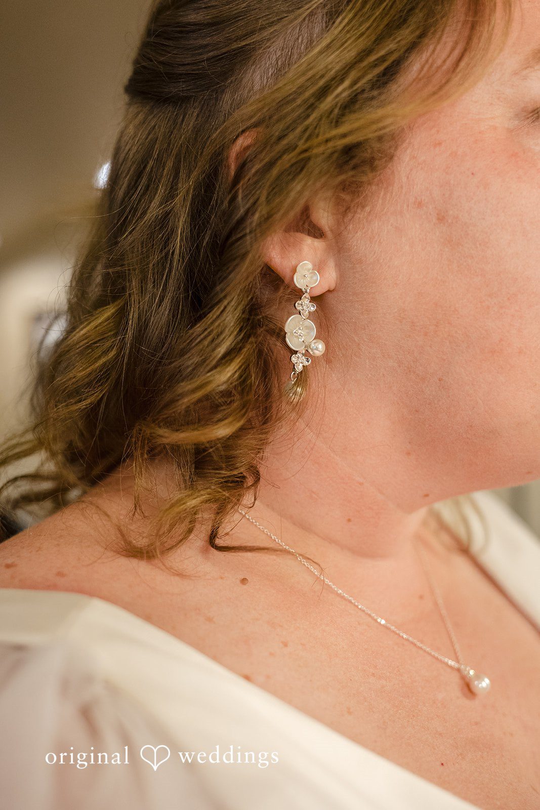 Faith + Brandon Close up of the bride with her earrings