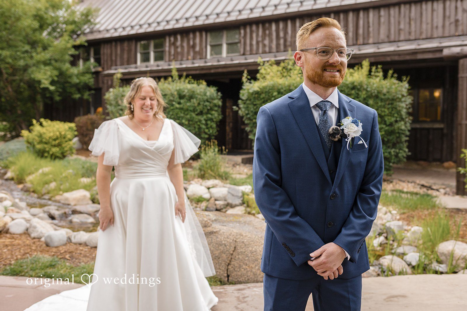 Faith + Brandon Couple smiling together outdoors among the rocks and pines, captured by Denver wedding photographers from Original Weddings at Spruce Mountain Ranch