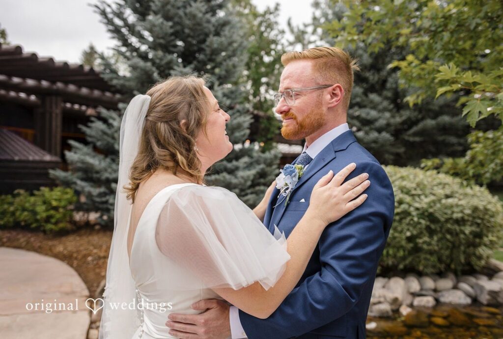 Denver Wedding Photographers at Spruce Mountain Ranch | Faith & Brandon 9 Bride and groom smiling together in the garden, captured by Denver wedding photographers from Original Weddings at Spruce Mountain Ranch