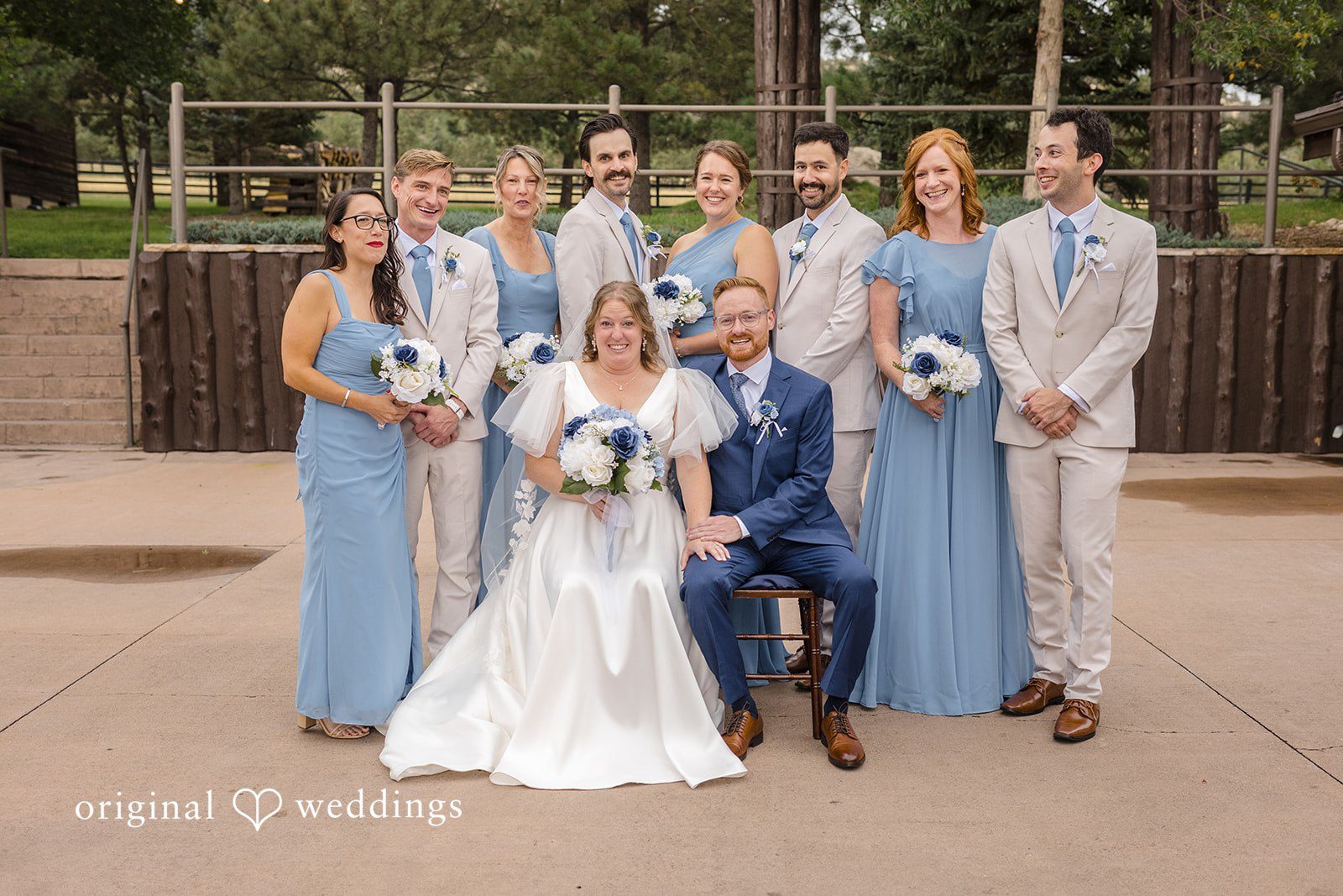 Faith + Brandon Wedding party celebrating together at Spruce Mountain Ranch