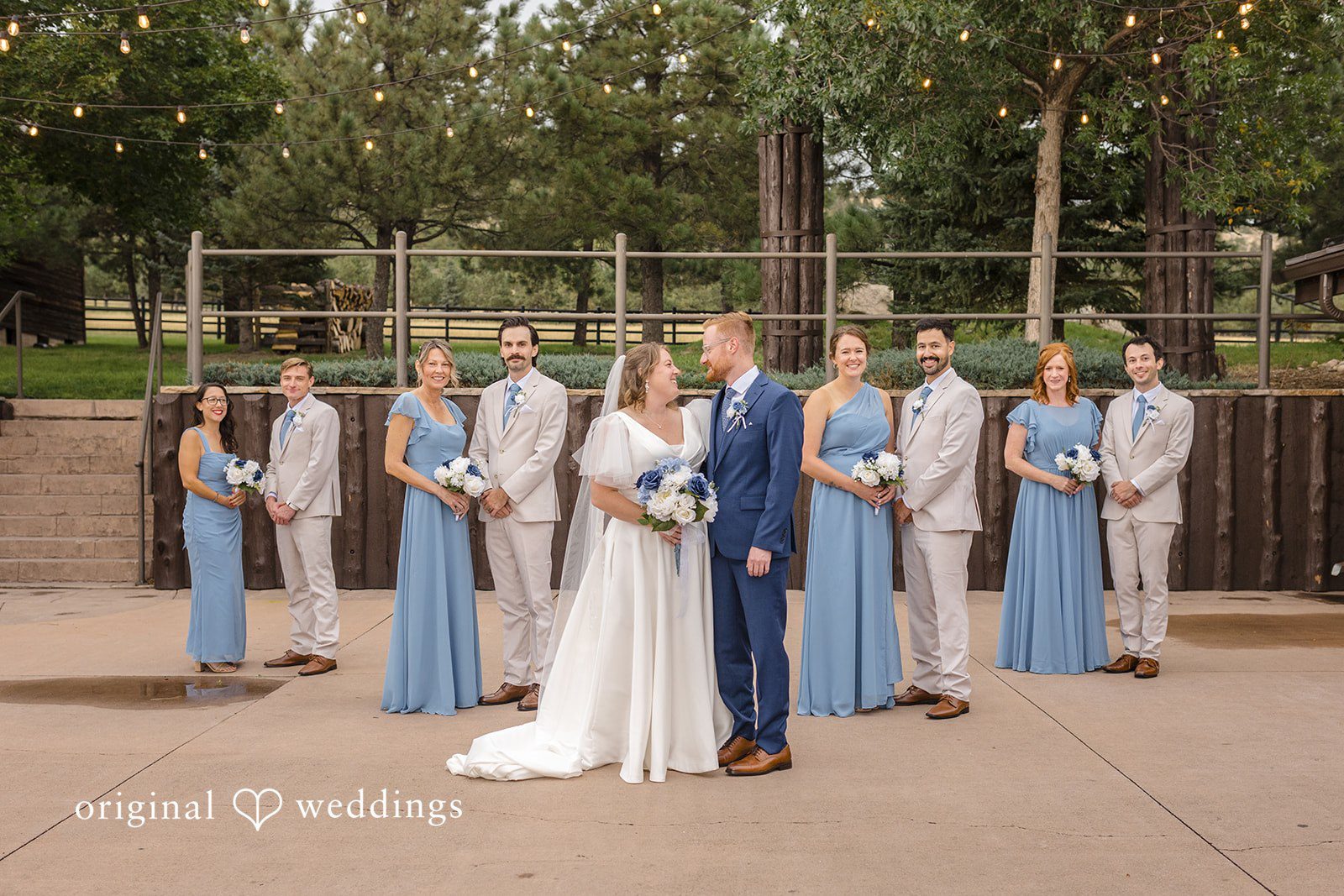 Faith + Brandon Wedding party lined up on the patio at Spruce Mountain Ranch