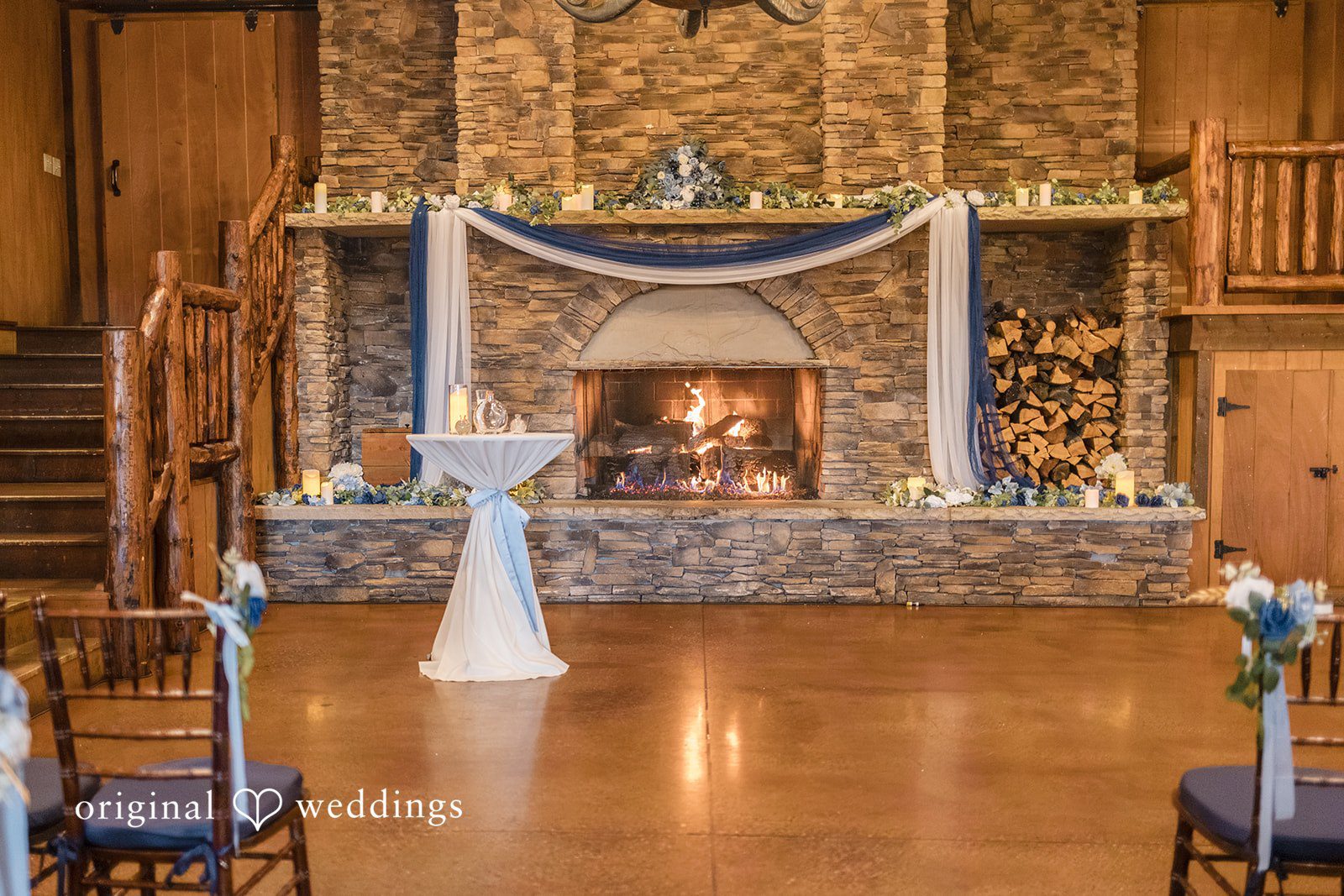 Faith + Brandon Ceremony space in front of the stone fireplace at Spruce Mountain Ranch