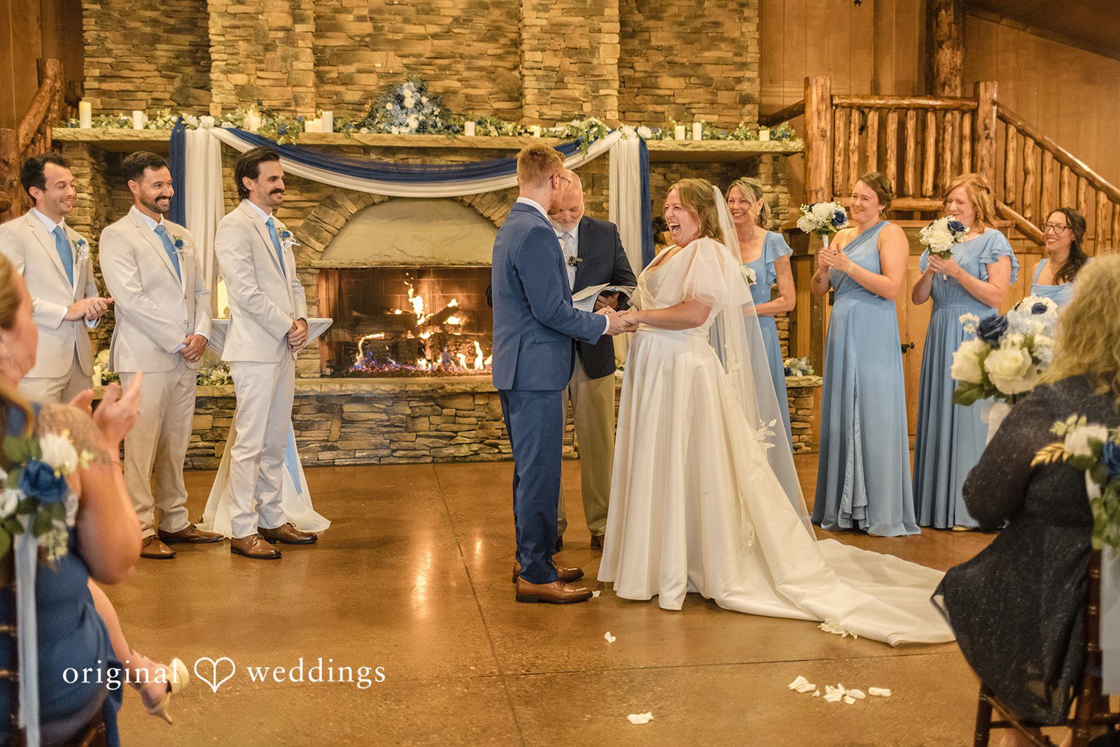 Faith + Brandon Wedding party standing at the fireplace altar at Spruce Mountain Ranch
