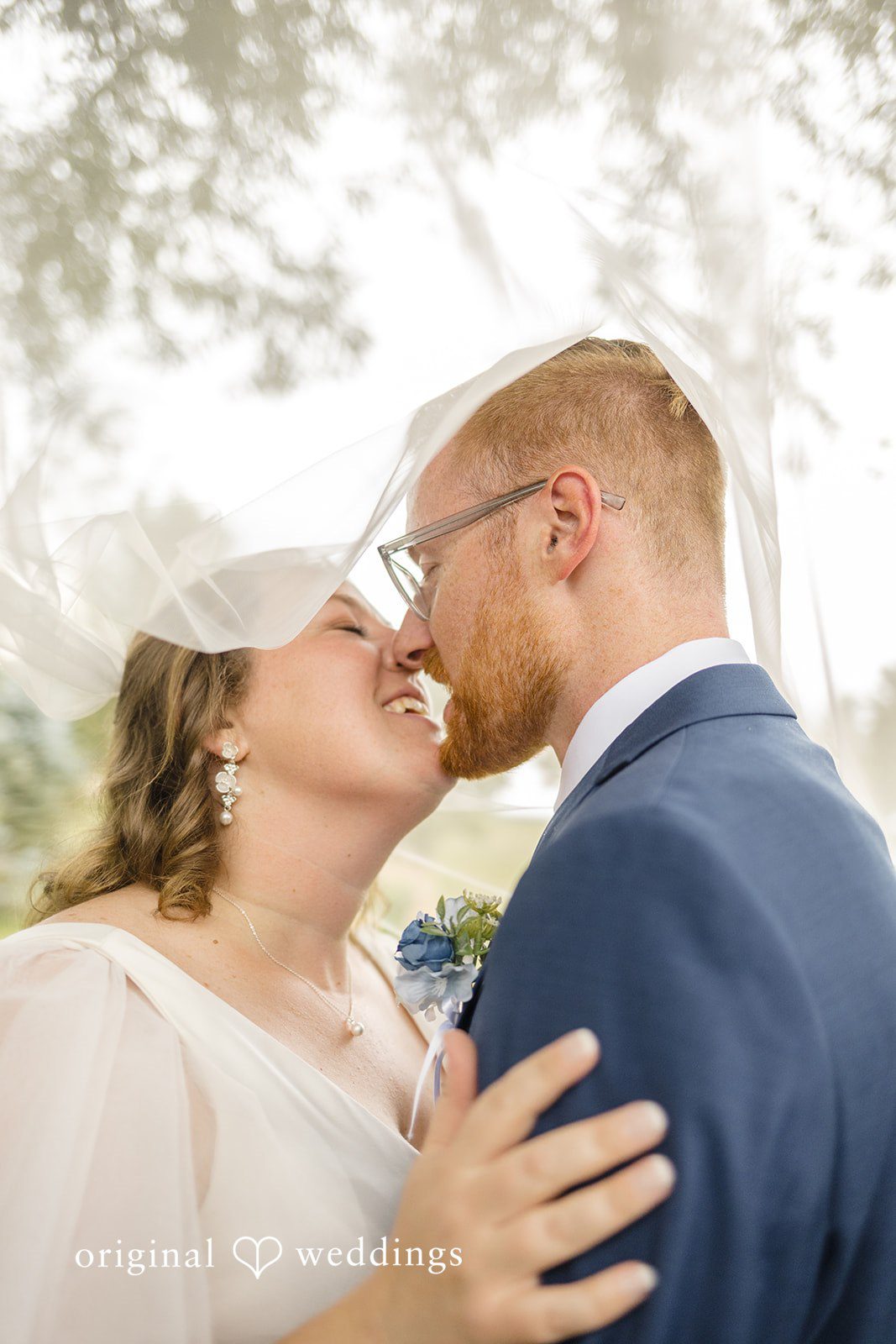 Faith + Brandon Couple sharing a close kiss
