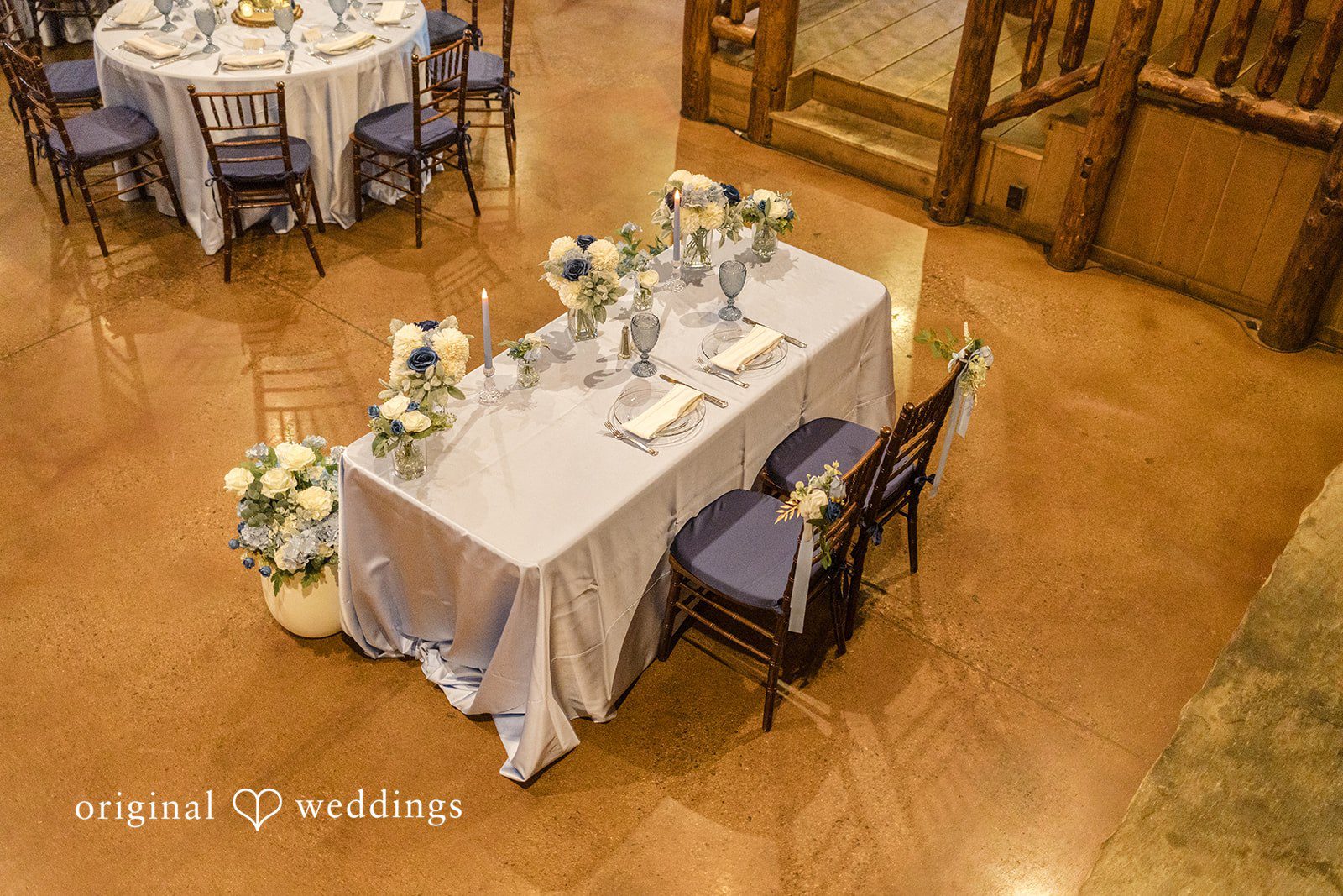 Faith + Brandon Sweetheart table decorated with flowers